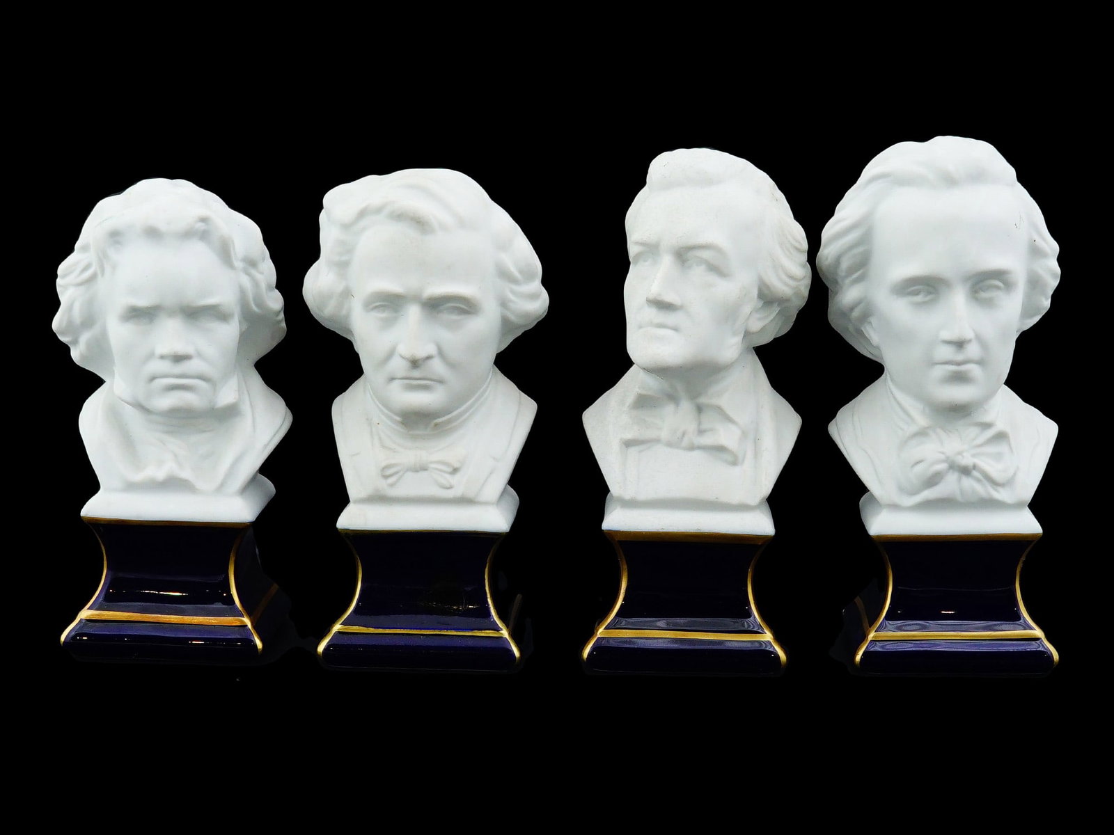 THARAUD LIMOGES PORCELAIN BUSTS OF FAMOUS COMPOSERS: A lot of four vintage biscuit porcelain busts by Tharaud Limoges. The artworks represents famous European composers, Frederic Chopin, Richard Wagner, Ludwig van Beethoven, and Hector Berlioz. Titled o