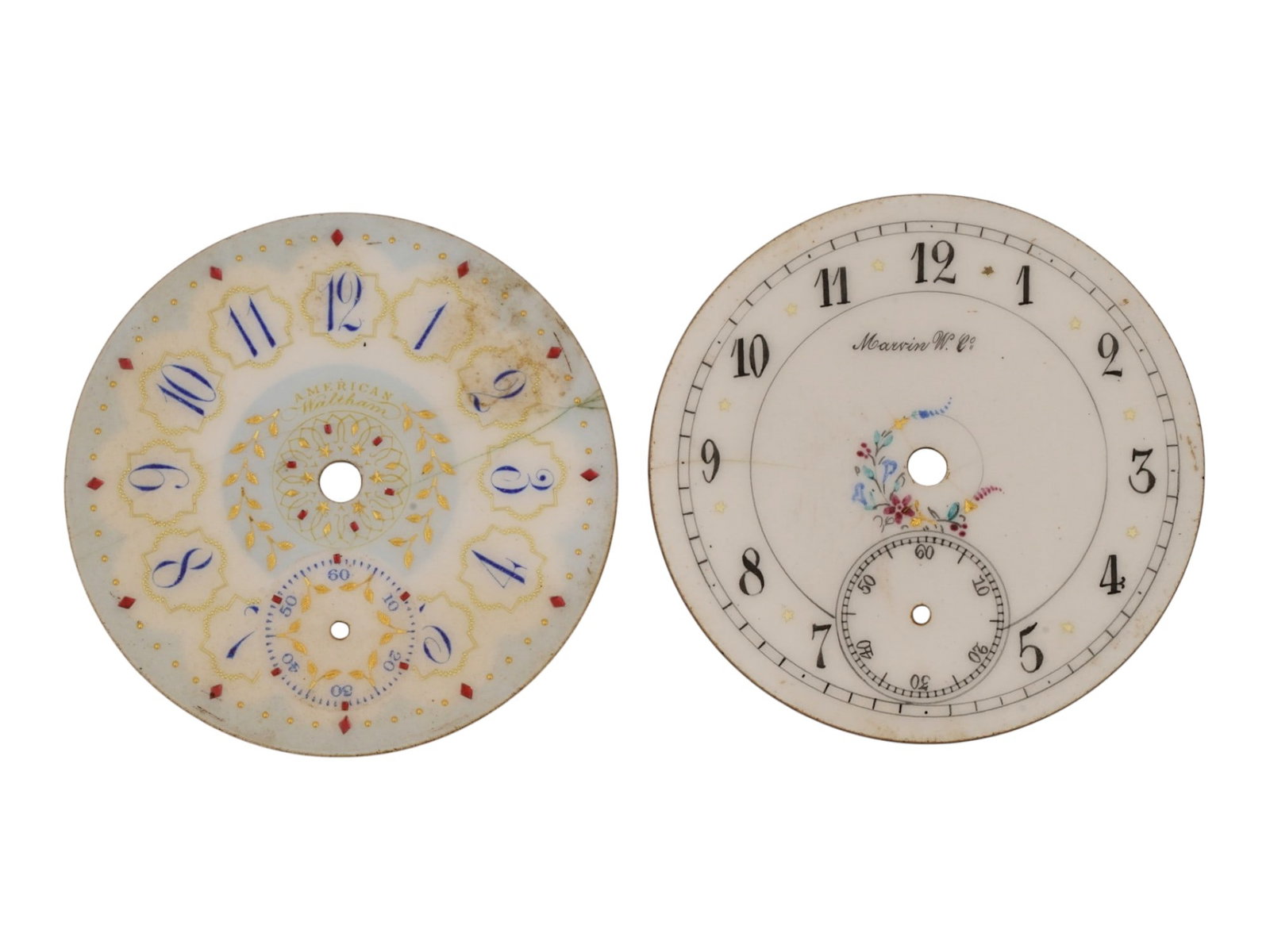 PAIR OF VINTAGE WALTHAM MARVIN PORCELAIN WATCH DIALS: A pair of vintage hand-painted porcelain watch dials. First. Waltham dial with cobalt blue Arabic numerals and elaborate gilded ornamentation. Second. Marvin W. Co. dial with Arabic numerals and a pol