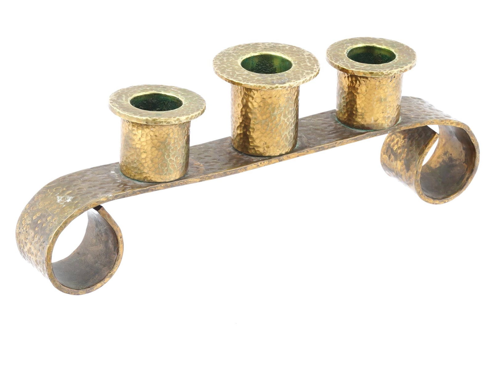 VINTAGE HAMMERED BRASS TABLE CANDELABRA THREE CANDLES: A vintage hammered brass table candelabra, designed to hold three candles. Features a base with elegantly curved edges for feet, providing both stability and a touch of classic charm. The hammered tex