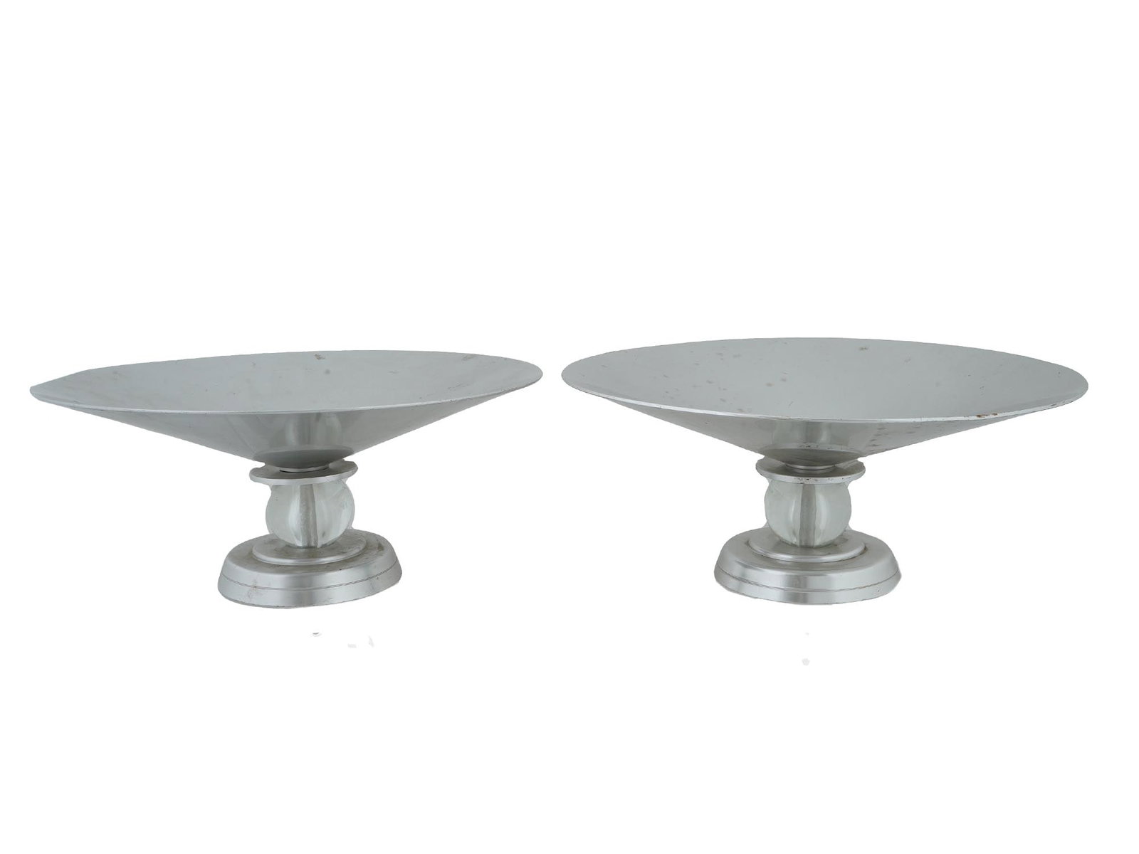 LURELLE GUILD DESIGN ART DECO ALUMINUM COMPOTES: A pair of Art Deco manner aluminum compotes. Designed by Lurelle Guild for the Kensington Ware. Circa: 1934. Each ware is mounted on a glass ball and a round shaped base. One of Americas most famous m