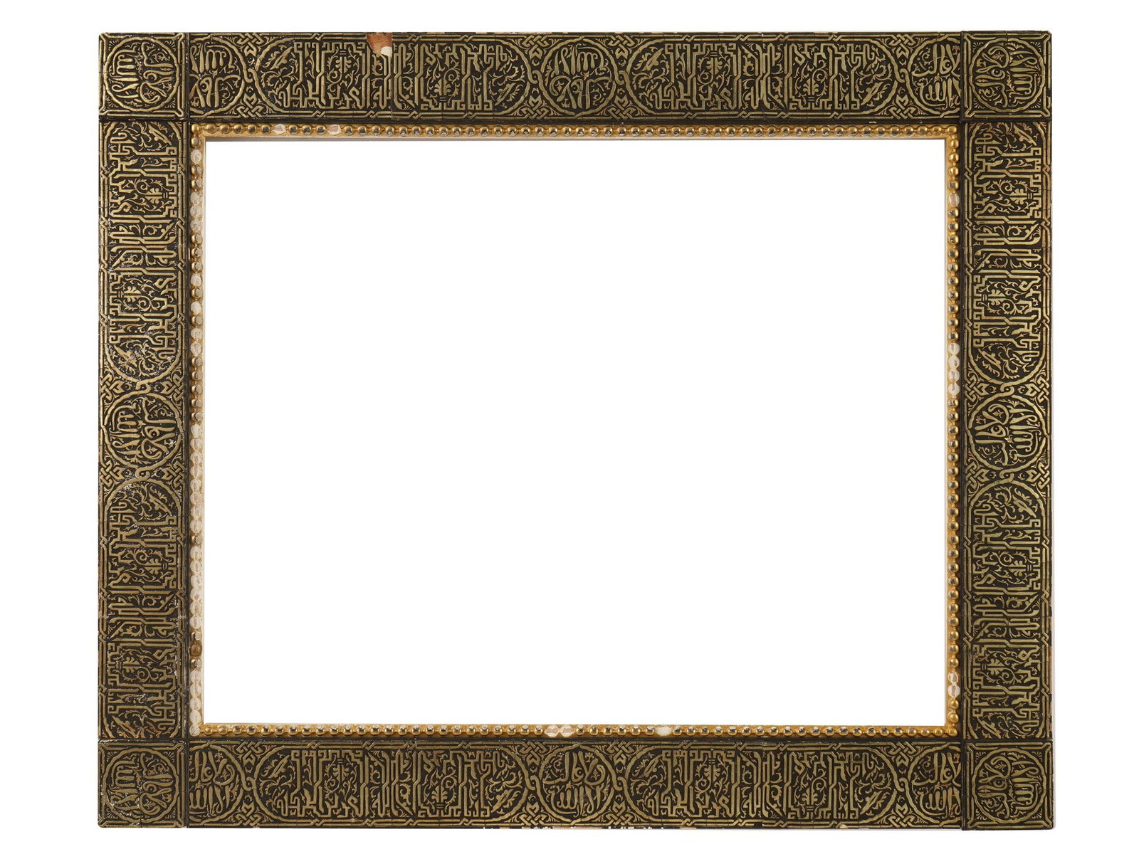 ANTIQUE ISLAMIC HISPANO MORESQUE REVIVAL PICTURE FRAME: An antique Islamic style or Hispano-Moresque Revival picture frame, dating to the 19th century. The frame features a wide, flat profile covered in dense pseudo-Kufic or Thuluth-style calligraphic orna