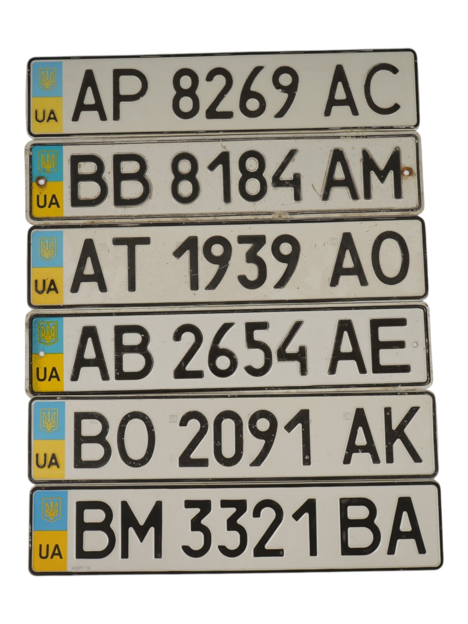 6 UKRAINIAN LICENSE PLATES FROM VARIOUS REGIONS: A lot of 6 License plates from various regions of Ukraine. The plates contain regional letter codes, numbers and series, as well as the state flag and coat of arms. These plates comply with the standa