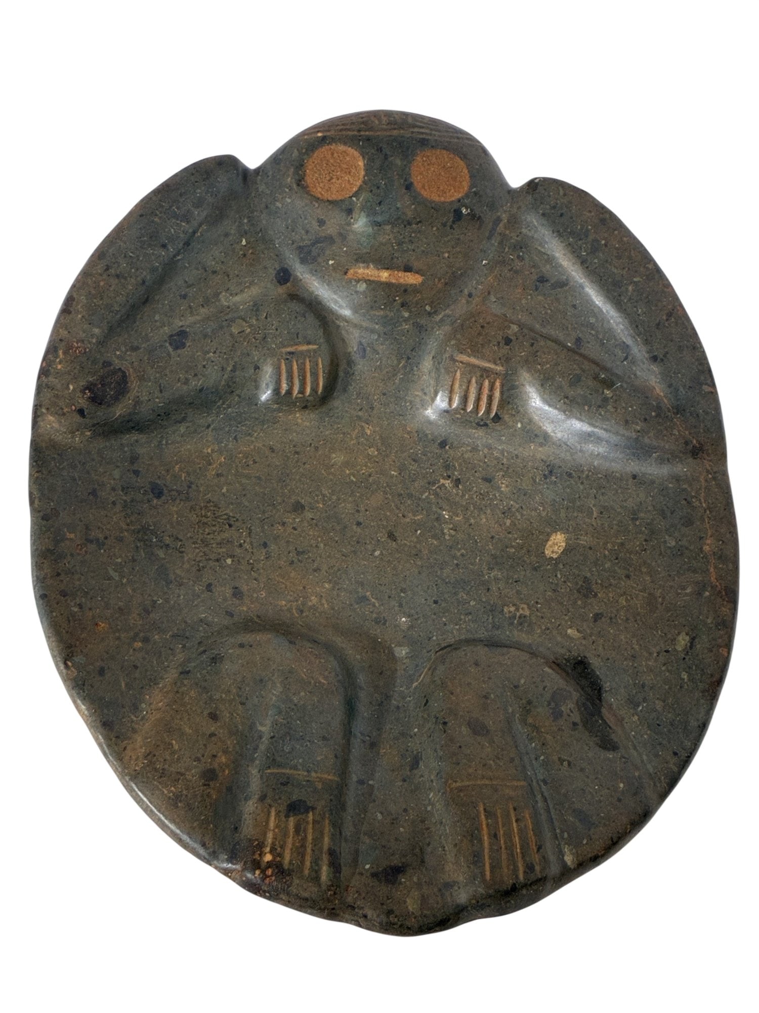 ANCIENT PRE COLUMBIAN TAINO ARAWAK CARVED STONE PLATE: An ancient Pre Columbian Taino Arawak carved stone sculpted ritual plate. The wide, almost flat round plate. The relief of the plate is modeled in the form of an anthropomorphic creature with arms and
