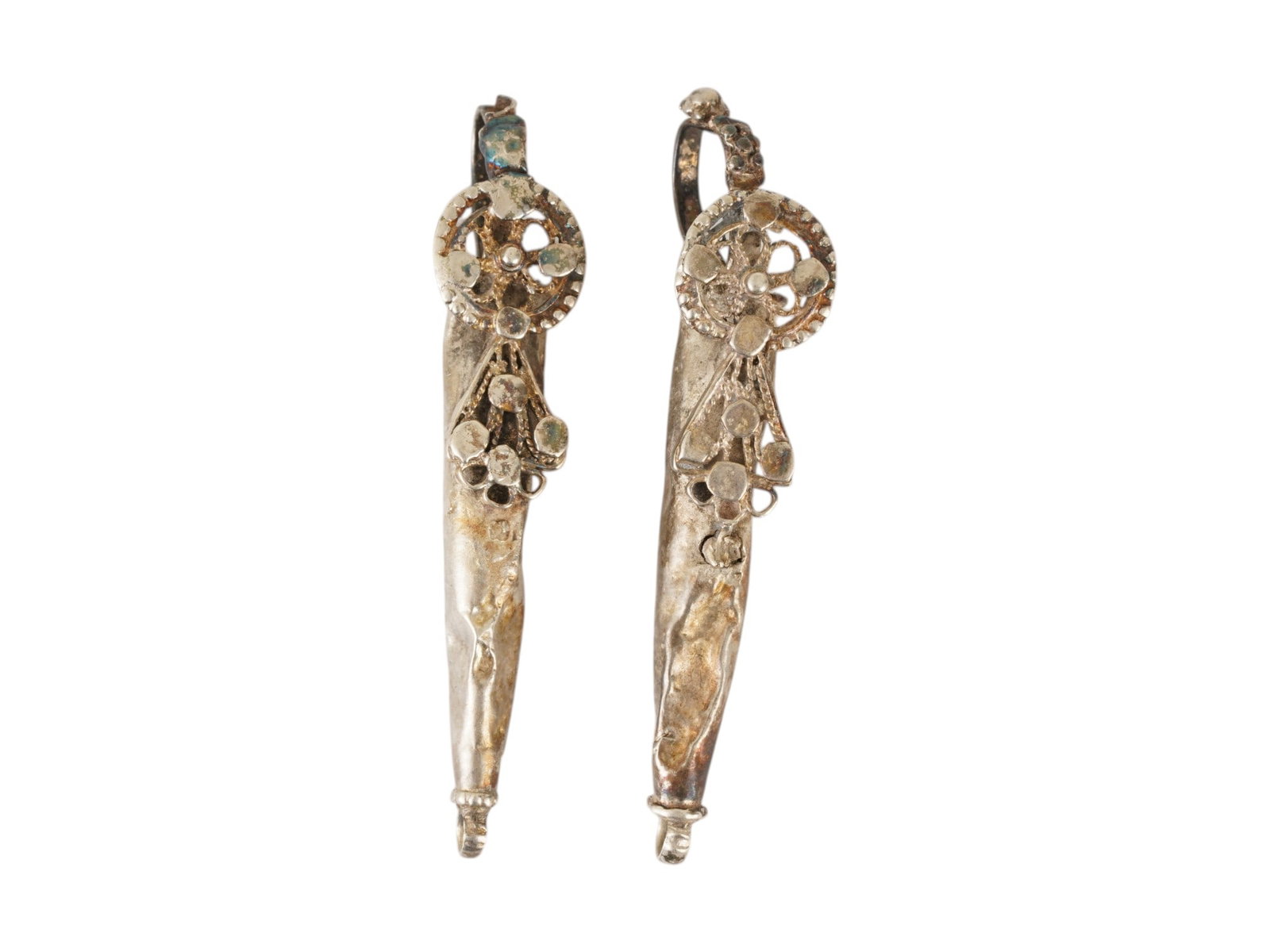 TWO ANCIENT BYZANTINE SILVER PENDANTS 350 TO 550 AD: A lot of two large ancient Byzantine silver conical pendants or earrings. Circa 350 to 550 AD. Each piece features a distinctive elongated conical shape and adorned with a central circular wheel eleme