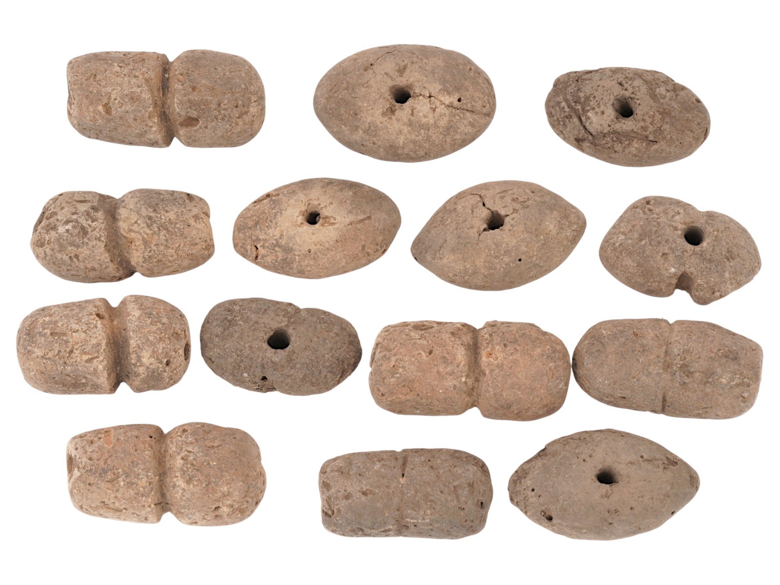 ANCIENT NEOLITHIC CLAY BEADS 5000 BC: A group of ancient neolithic Western Asiatic clay beads. Circa 5000 BC and later. Beads of various shapes, mostly roughly cylindrical with a hole in the middle. A total of 14 pieces. Historical Collec