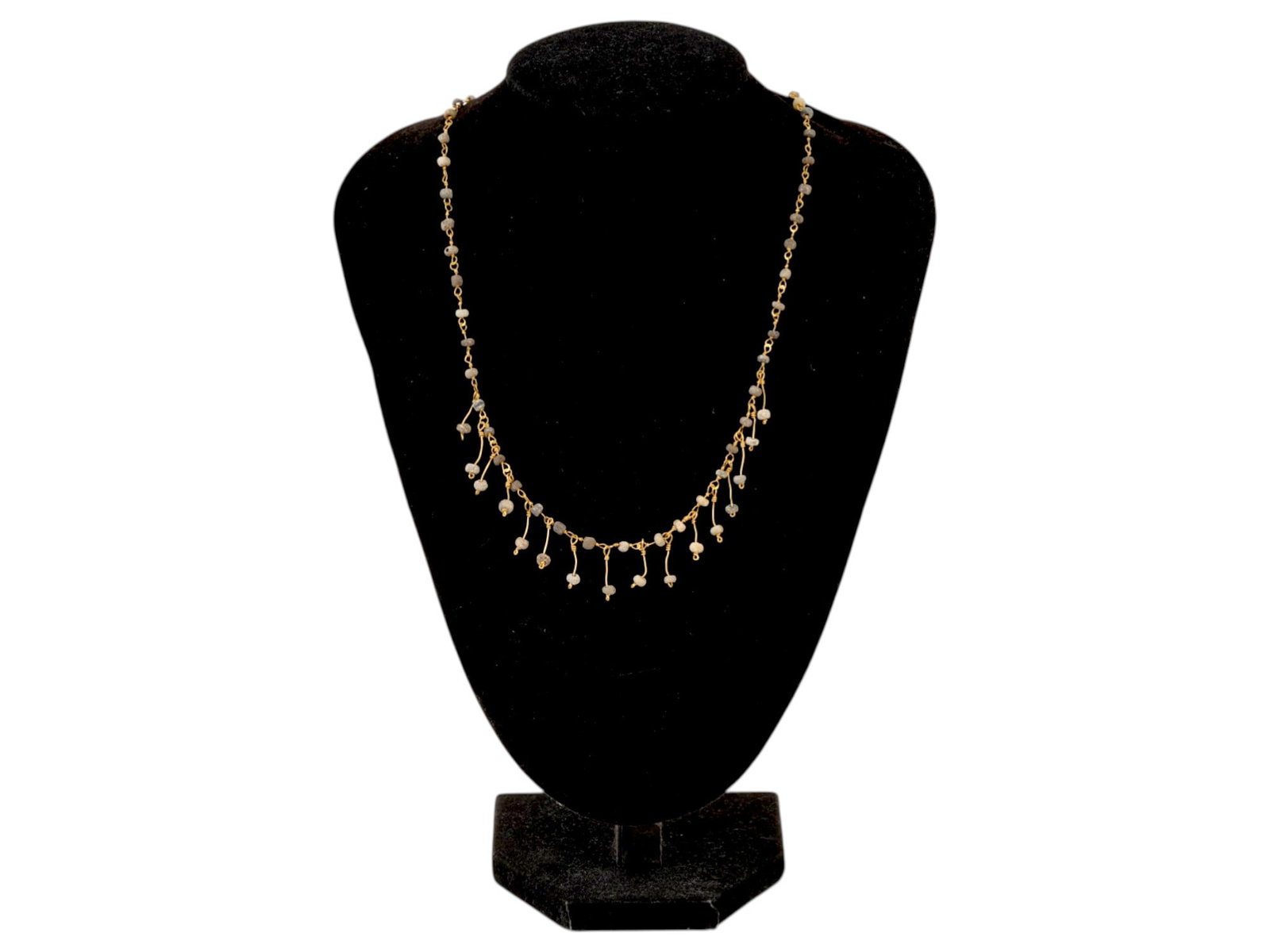 ANCIENT ROMAN GOLD NECKLACE WITH GLASS BEADS DANGLES: An ancient Roman gold necklace, dating from 100 to 300 AD. The necklace is composed of gold links interspersed with glass beads. The glass beads are arranged along the chain, while the inclusion of gl