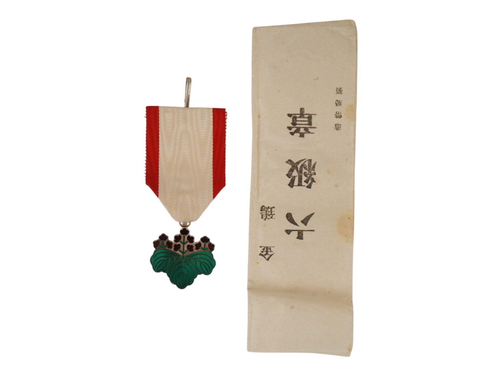 JAPANESE SILVER ORDER OF THE RISING SUN 7TH CLASS: A Japanese civil award, Order of the Sacred Treasure for meritorious service to the state, 7th class. Established in 1875 by Emperor Meiji. Enameled silver medal in the shape of three paulownia leaves