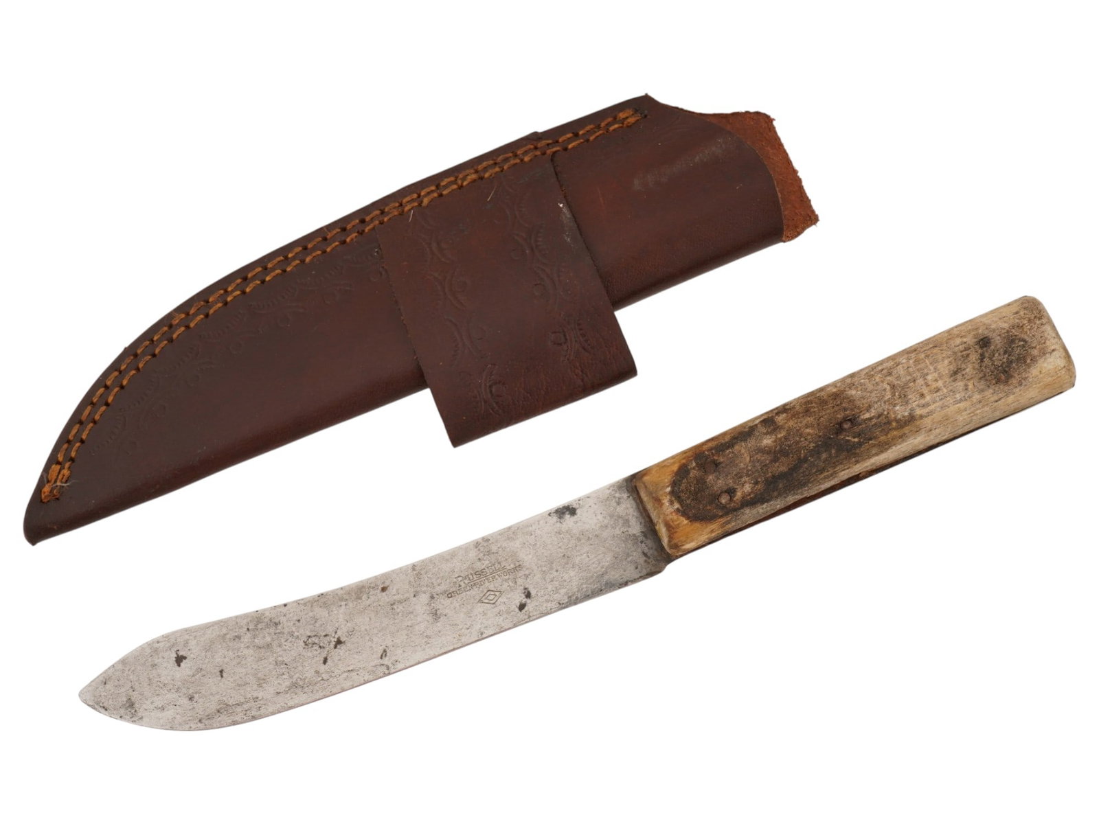 ANTIQUE AMERICAN RUSSELL GREEN RIVER WORKS TRADE KNIFE: An antique American Russell Green River Works fixed-blade trade knife with scabbard. The knife is characterized by a slightly curved steel blade and a rectangular light-toned wooden handle. The blade