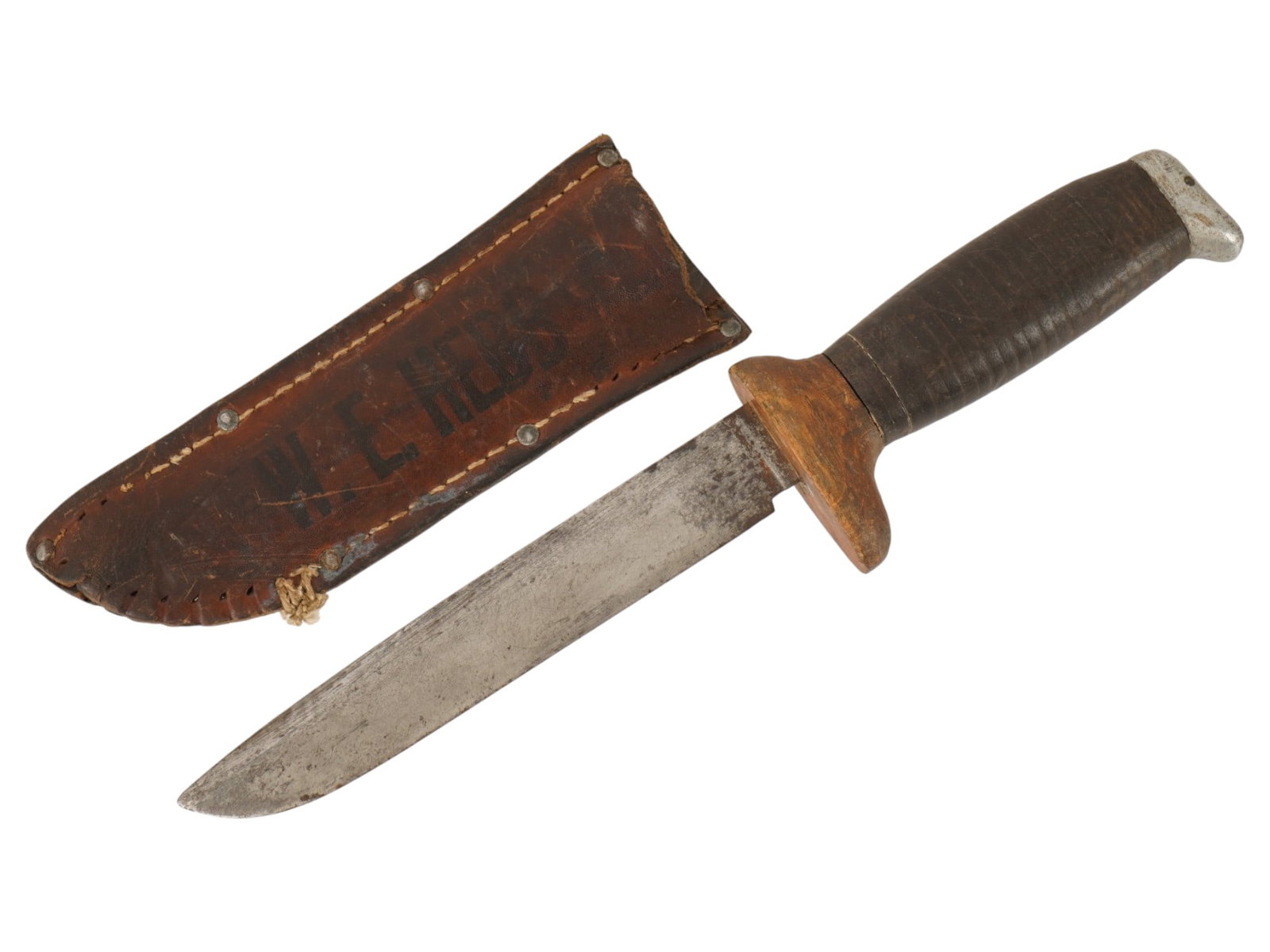 MID CENTURY HUNTING KNIFE WITH LEATHER SHEATH: A mid-20th century hunting knife. Classic stainless steel blade. Wooden and leather handle. Leather sheath, marked W.E. Hebb. Hunting Equipment, Knives And Swords, Cold Weapons. THIS LOT IS ELIGIBLE F