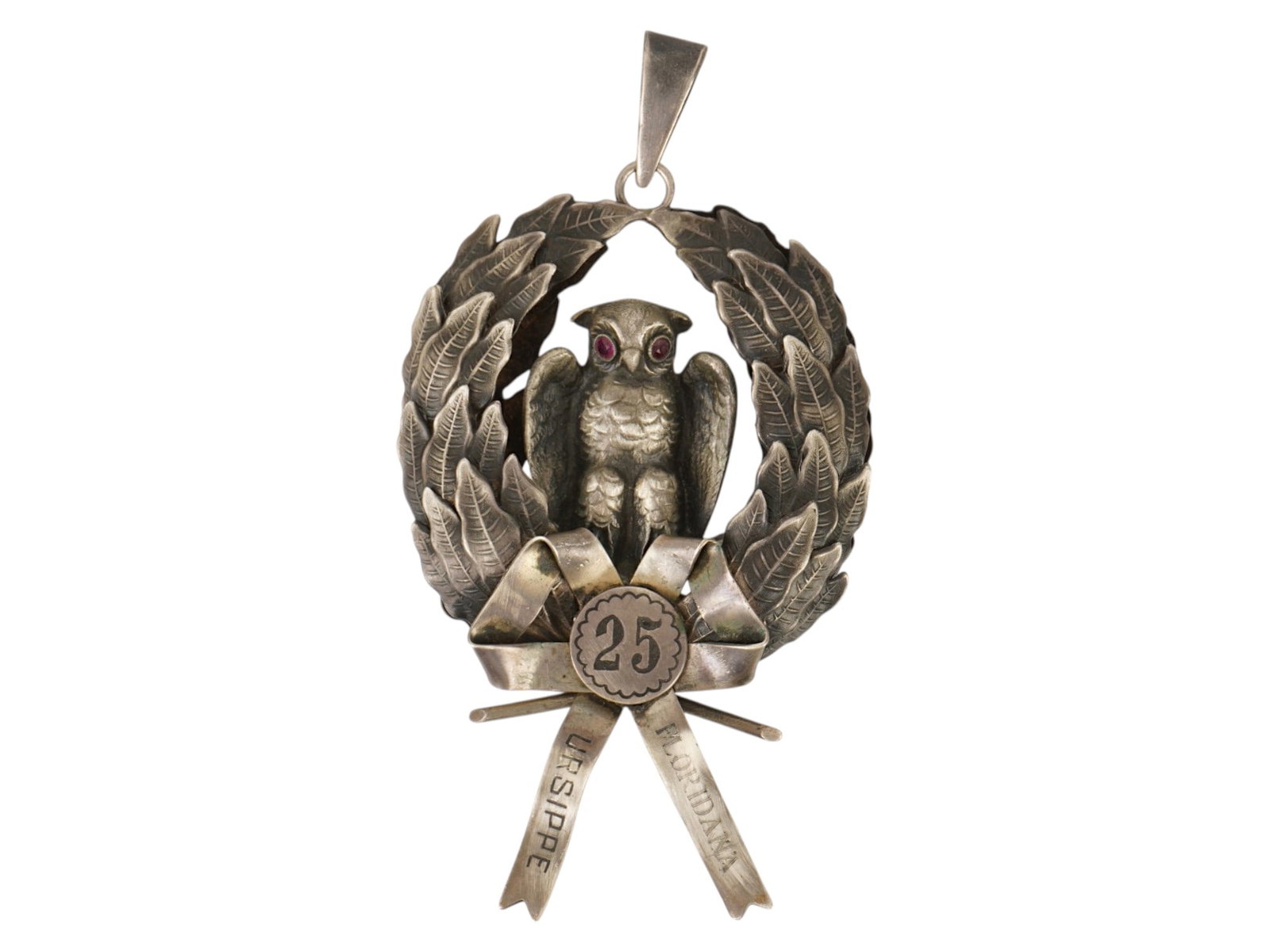 ANTIQUE GERMAN SILVER ORDER OF SCHLARAFFIA SOCIETY: An antique late 19th-century silver award badge, 25th years of membership of Schlaraffia, a worldwide exclusively male German-speaking society founded in Prague in 1859. The badge is a pendant represe