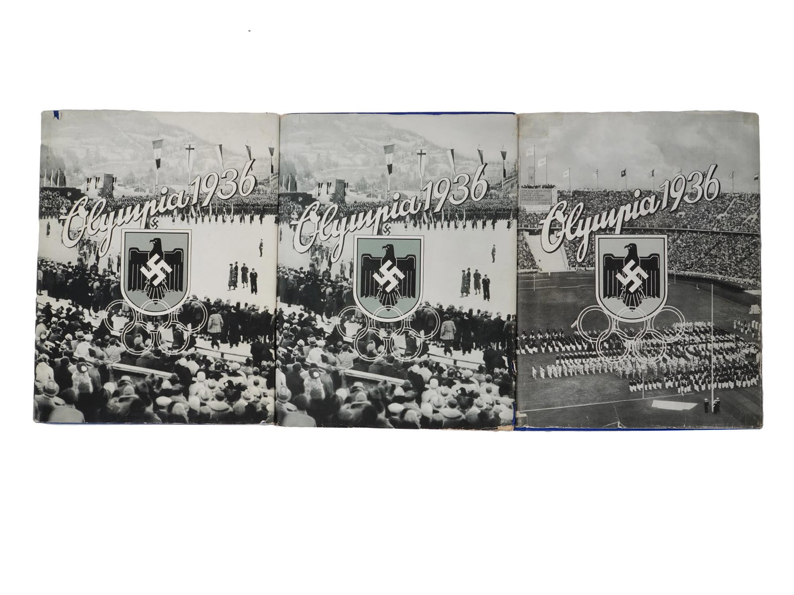 NAZI GERMAN BOOK EDITION OLYMPIC GAMES BERLIN 1936: A vintage Nazi German book edition on the Olympic Games in Berlin, published by Reemtsma Cigarettenfabriken. Two volumes titled The 1936 Olympics, published in Altona-Bahrenfeld in 1936. With an addit
