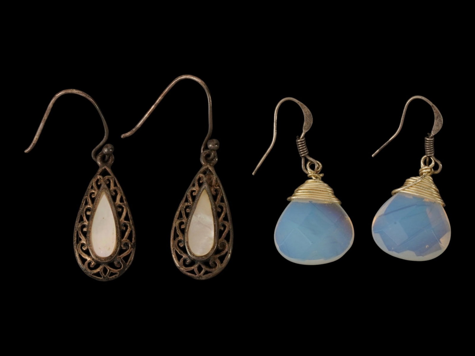 LOT OF SILVER MOTHER OF PEARL AND OPALITE EARRINGS: A pair of vintage silver hook earrings with drop-shaped dangles. One pair is garnished with mother-of-pearl and marked 925. The second is made of opalite. Total Weight: 10 g. Vintage Jewelry And Fashi