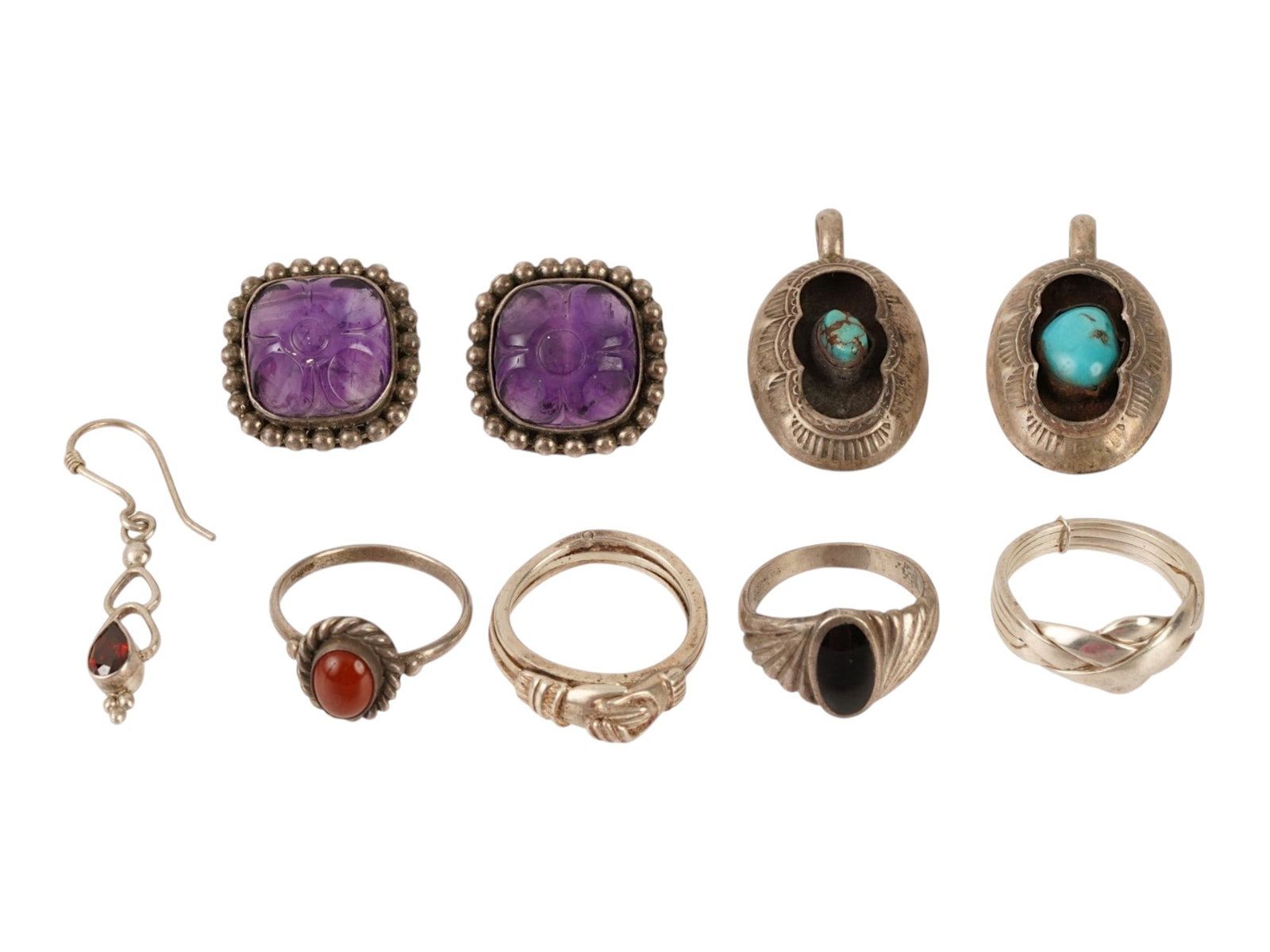 LOT OF STERLING SILVER AND GEMSTONE JEWELRY: A lot of vintage silver jewelry. A total of 4 rings, 2 identical pendants, a pair of stud earrings, and a single hook earring. The pieces are set with amethyst, turquoise, onyx, carnelian. Marked Ster