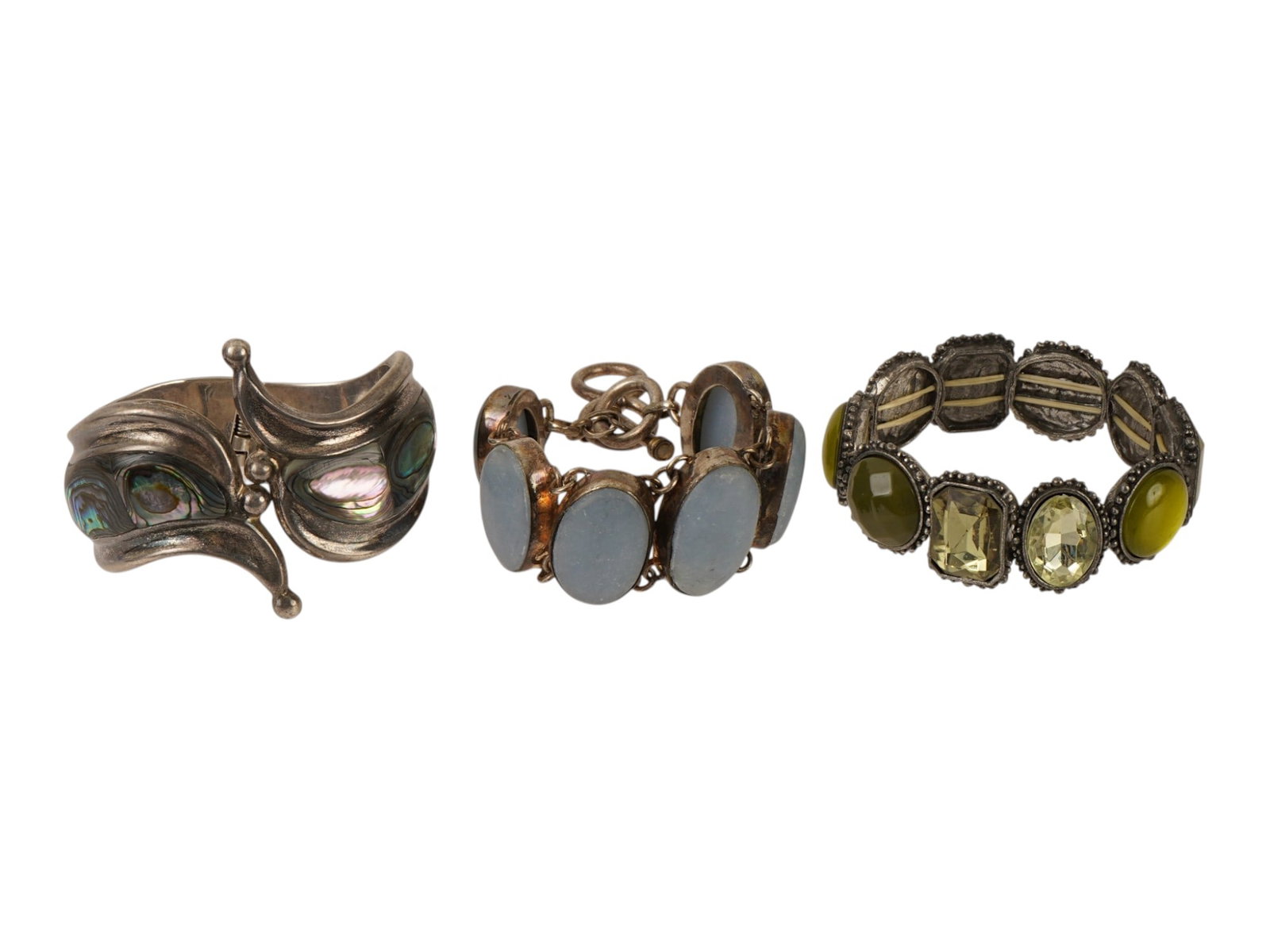 VINTAGE STERLING SILVER AND GEMSTONE BRACELETS: A lot of three vintage Mexican sterling silver statement bracelets. Each is richly embellished with stones, including agate, abalone shell, and crystals. Marked 925 on the backside. Vintage Jewelry An