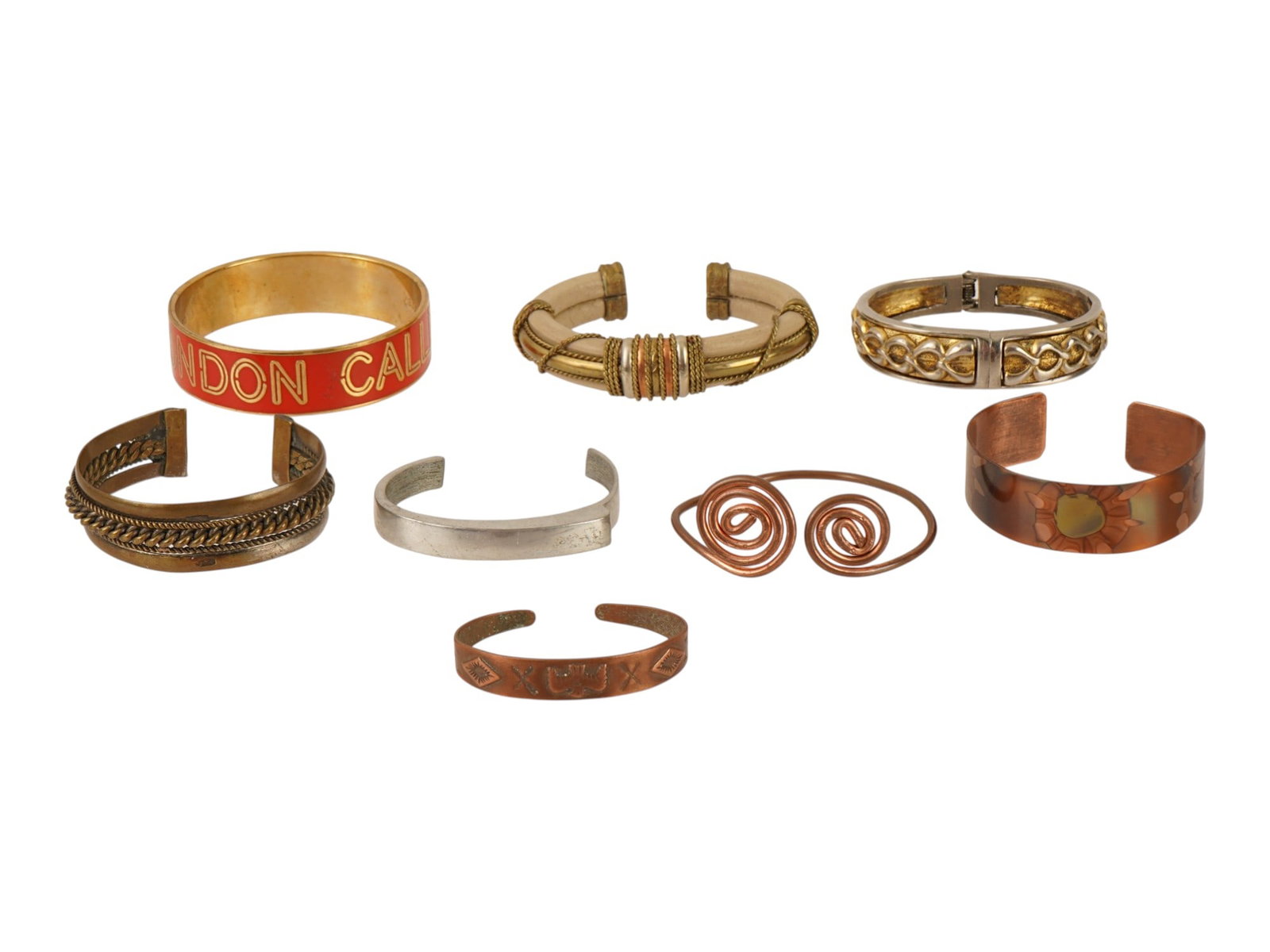 LOT OF 8 VINTAGE DESIGNER BANGLE BRACELETS: A lot of 8 vintage bangle and cuff bracelets of various design. Bold statement pieces. One bracelet is from Kate Spade. Vintage Jewelry And Fashion Accessories. THIS LOT IS ELIGIBLE FOR A 30-DAY