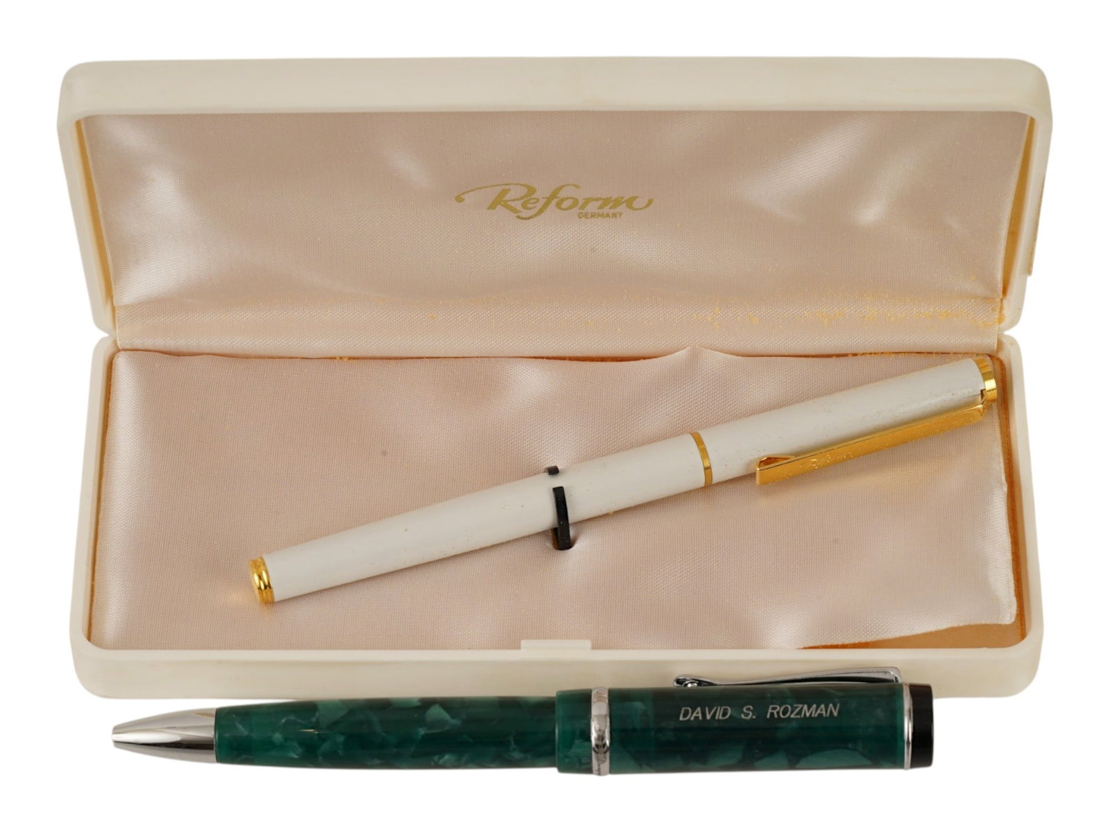 VINTAGE CONKIN REFORM BALLPOINT AND FOUNTAIN PENS: A pair of vintage pens. Conkin ballpoint pen in green, engraved name David S. Rozman on the cap. Reform fountain pen in white, comes in original box. Collectible Writing Instruments, Desk Accessories,