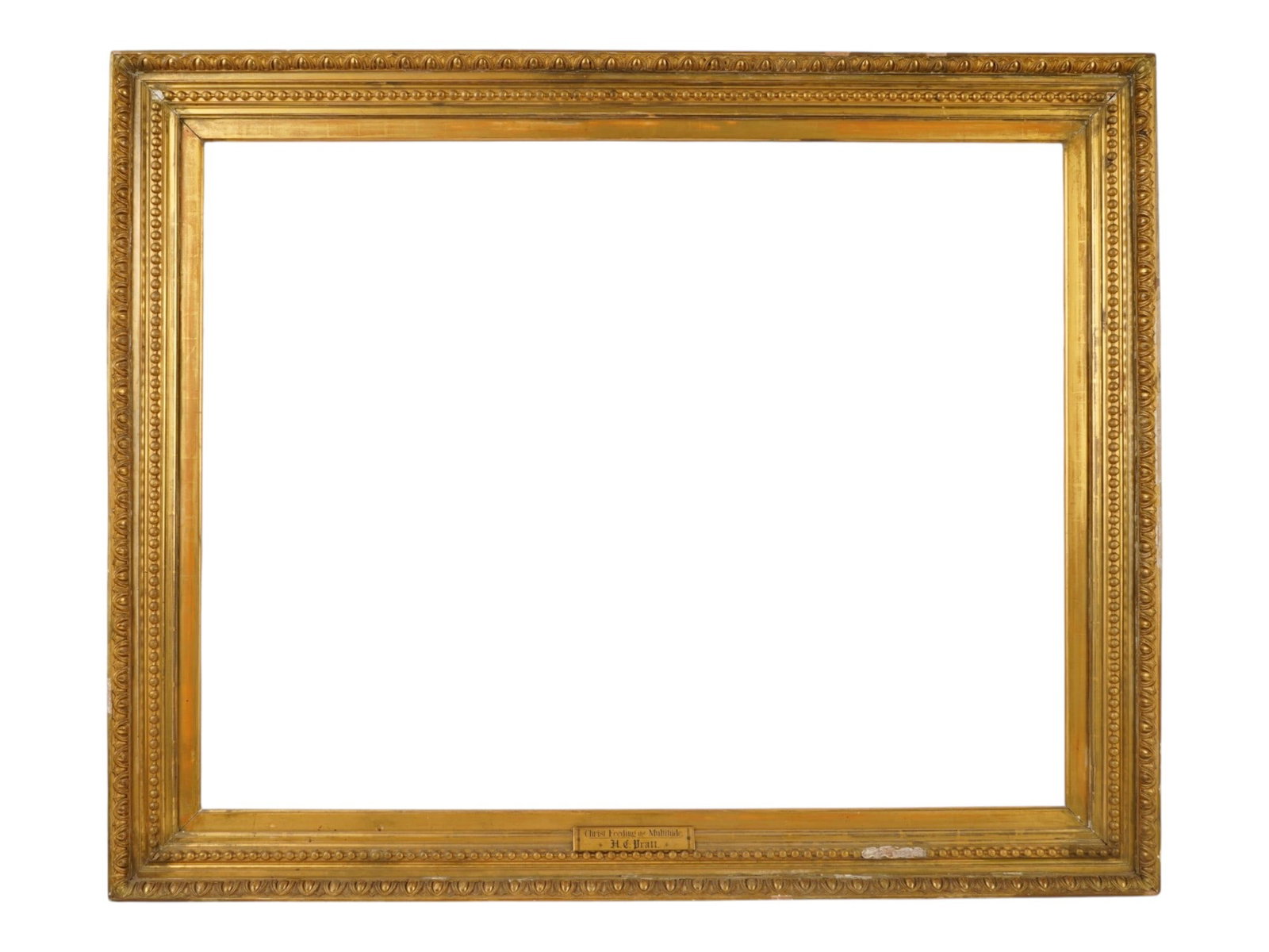 ANTIQUE AMERICAN GILDED WOOD PICTURE FRAME: An antique American gilded wood picture frame featuring ornate egg-and-dart relief molding along the outer border and inner lip. The frame includes a brass artist plaque reading H.D. Pratt. The gilded