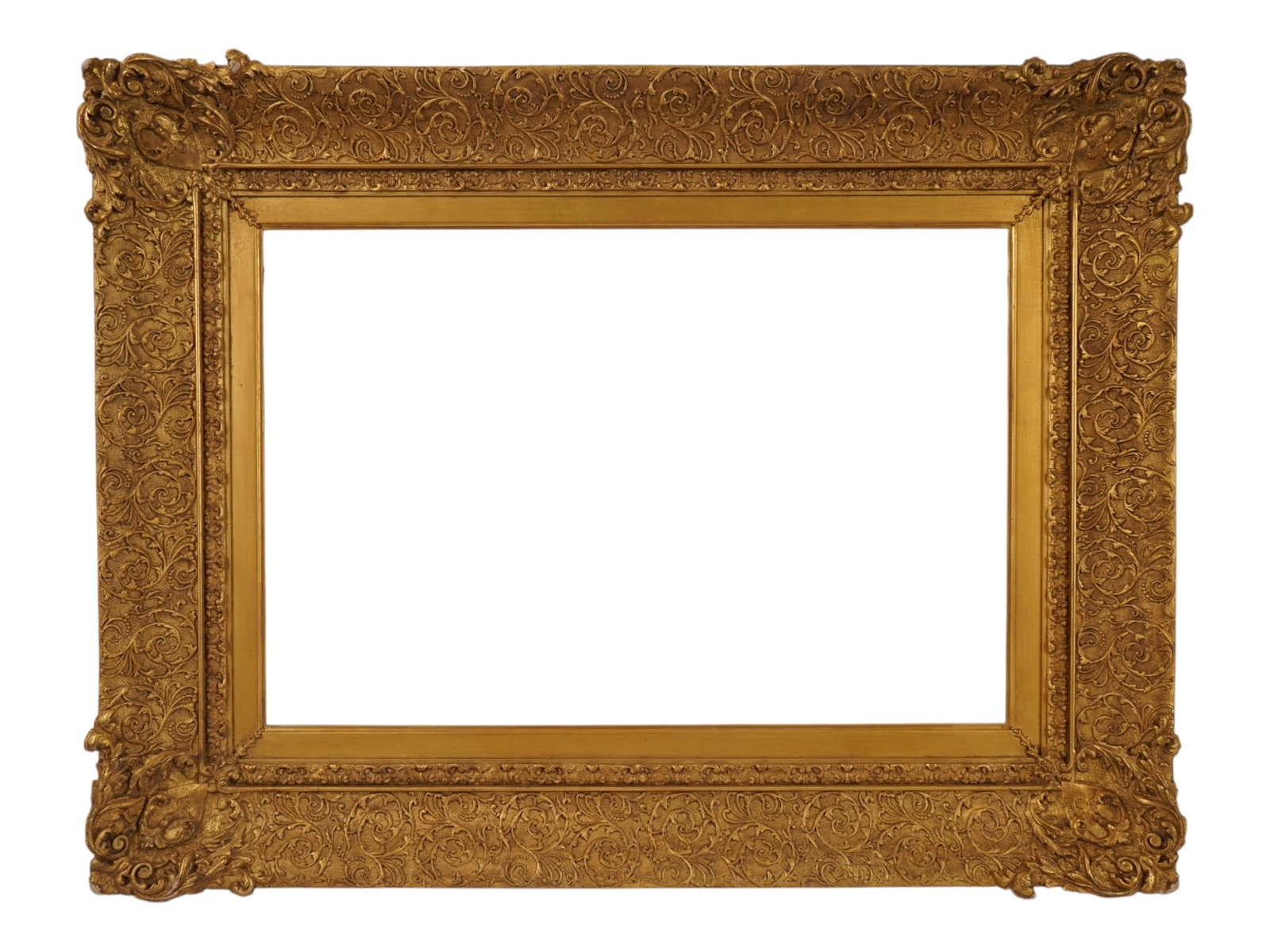 VINTAGE RECTANGULAR ORNATE GILTWOOD DECORATIVE FRAME: A vintage rectangular decorative frame, constructed of wood with ornate gilded composition ornamentation. The design features prominent corner flourishes with scrolling acanthus leaves and shell motif