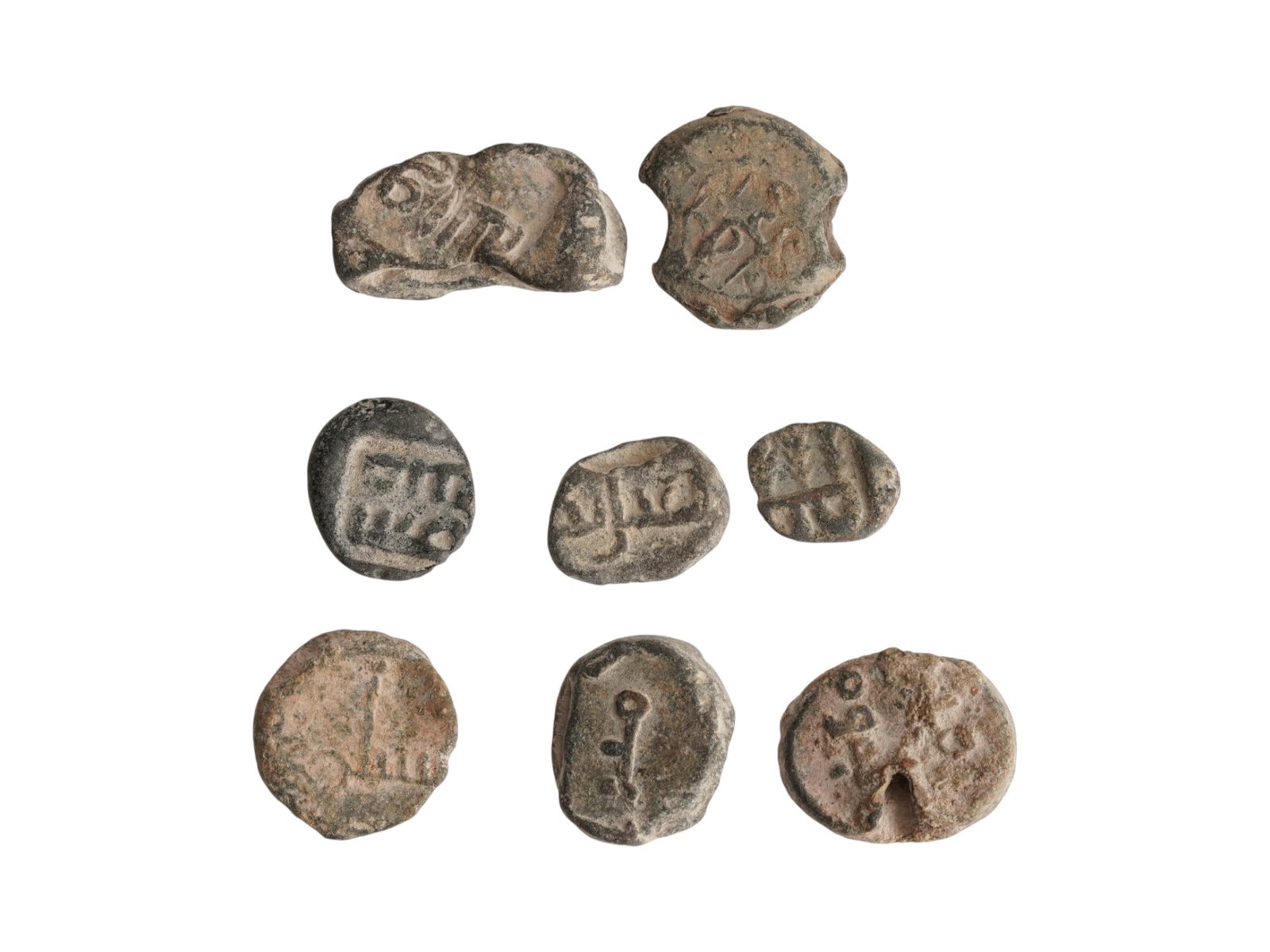 GROUP OF ANCIENT ISLAMIC LEAD SEALS 600-900 AD: A lot of ancient Islamic lead seals. Ca. 600 to 900 AD. A total of 8 items. With inscriptions in Arabic. Archaelogical Finds And Historical Collectibles, Stamps And Seals, Muslim World, Near East. THI