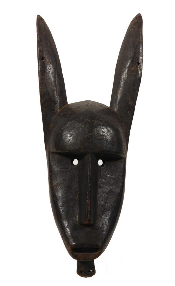 African Tribal Art Rabbit Mask.: Bambara people, Mali. Simply carved, the strong forehead, deep set circular eyes, thin straight nose, horizontal open mouth and upright ears give this mask its impressive character. 22 in H. Evidence