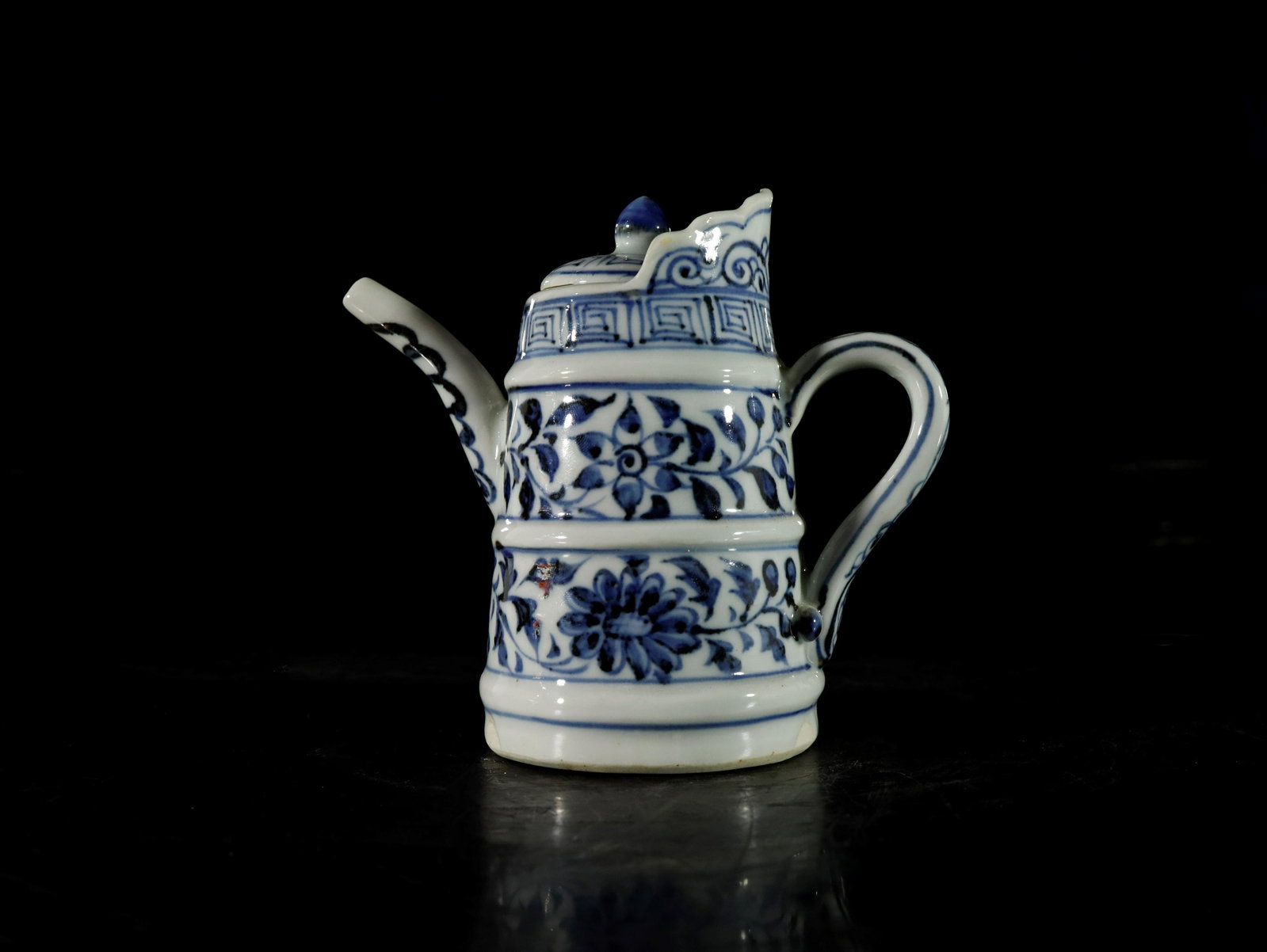 A blue and white 'flower' ewer: A blue and white 'flower' ewer Chinese Ming Dynasty size: 12.5cmx12cm