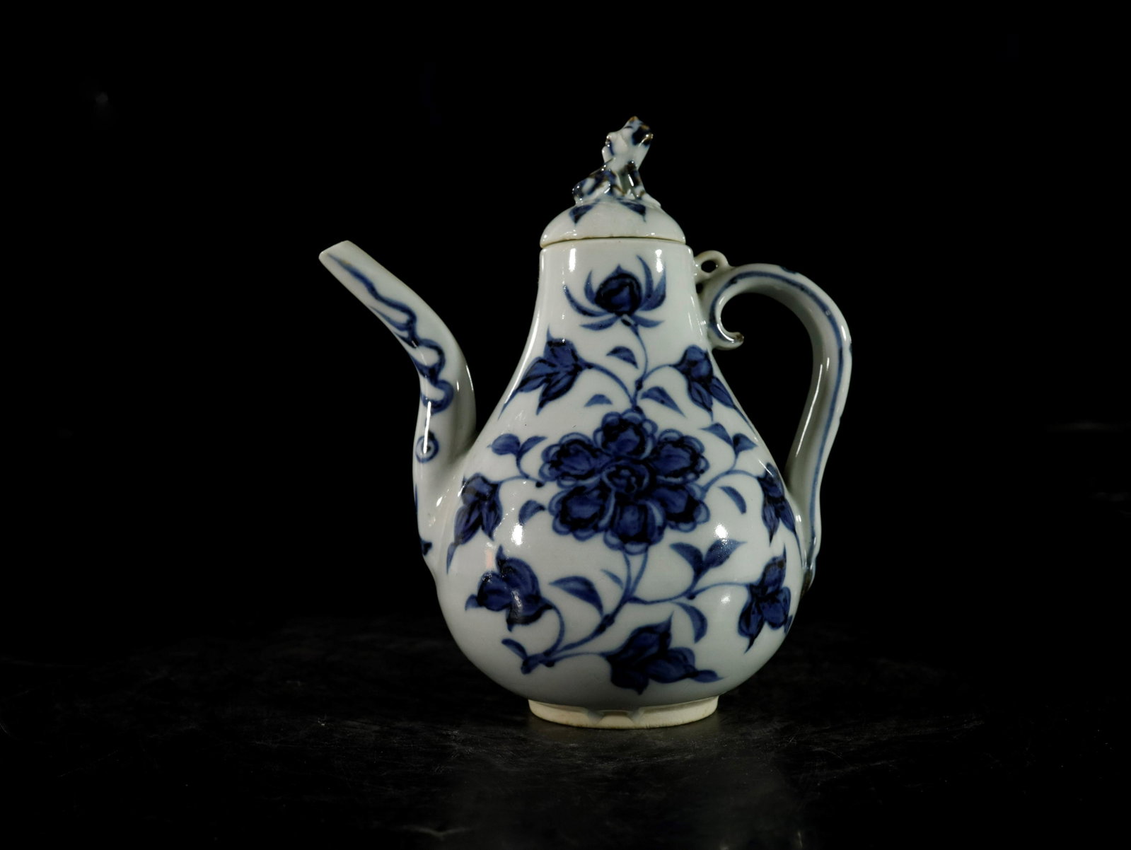 A blue and white 'flower' ewer: A blue and white 'flower' ewer Chinese Ming Dynasty size: 13cmx15cm