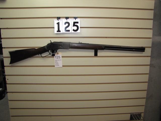 Winchester 1873 Lever Action Rifle in 44 WCF: Winchester 1873 Lever Action Rifle in 44 WCF 24" barrel with a bright clean bore and original sights and working loop lock with crack in fore end on right side.