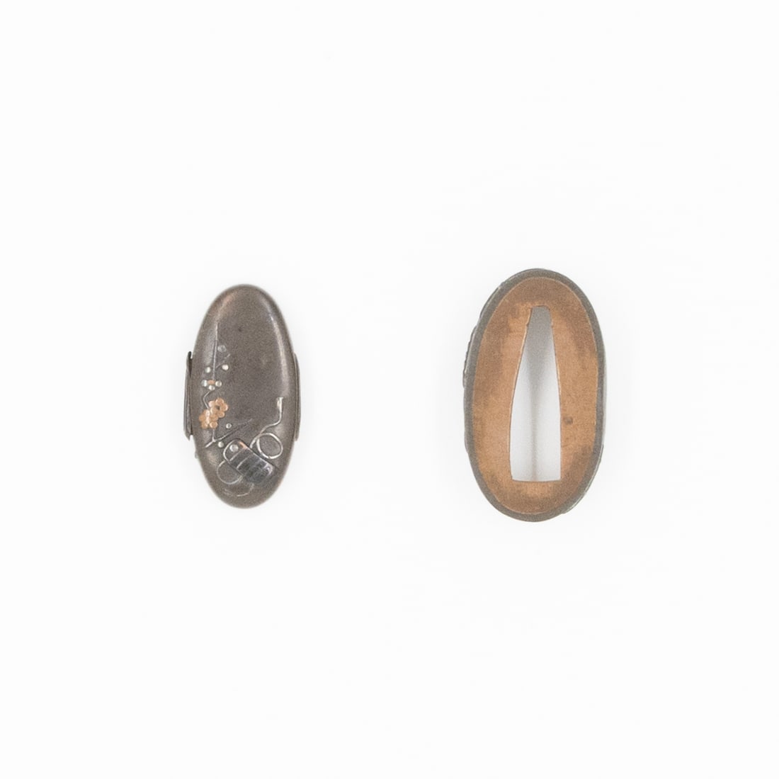 Japanese Fuchigashira, Plum Tree and Eboshi, 19th-Century: 19th-century fuchigashira with the design of plum tree and eboshi Size: approx. (H) 3.8 x (W) 2.1 x (D) 0.9 cm Condition: Some loose parts on the sides. Ref: F4