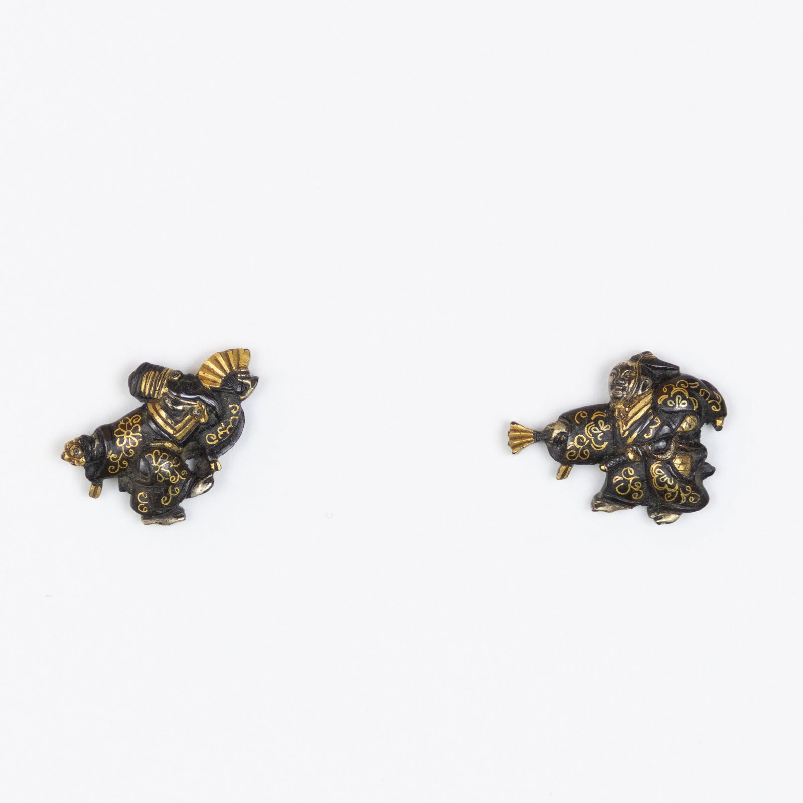 Japanese Menuki, Sanbaso Dancing, NBTHK Hozon: Japanese Menuki with the design of Sanbaso Dancing Mumei, attributed to Kyo-Kanagu-shi NBTHK Hozon certificate Date: 19th century Size: (L) 2.5 x 1.7 cm, (R) 2.0 x 2.5 cm Condition: Minor gilt wear. R