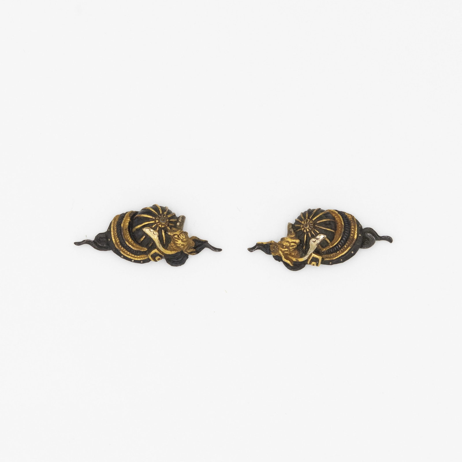 19th Century, Japanese Menuki, Kabuto Helmets Design: Japanese Menuki with the design of Kabuto helmets 19th century Size: (L) 4.0 x 1.5 x 0.7 cm, (R) 3.9 x 1.6 x 0.6 cm Condition: Minor gilt wear Ref: JG012601