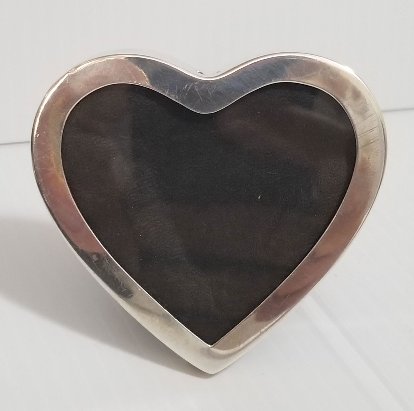 Sterling Heart Picture Frame: sterling picture frame, picture: 2 3/4 x 2 1/4 inches, frame: 2 7/8 x 2 7/8 inches.