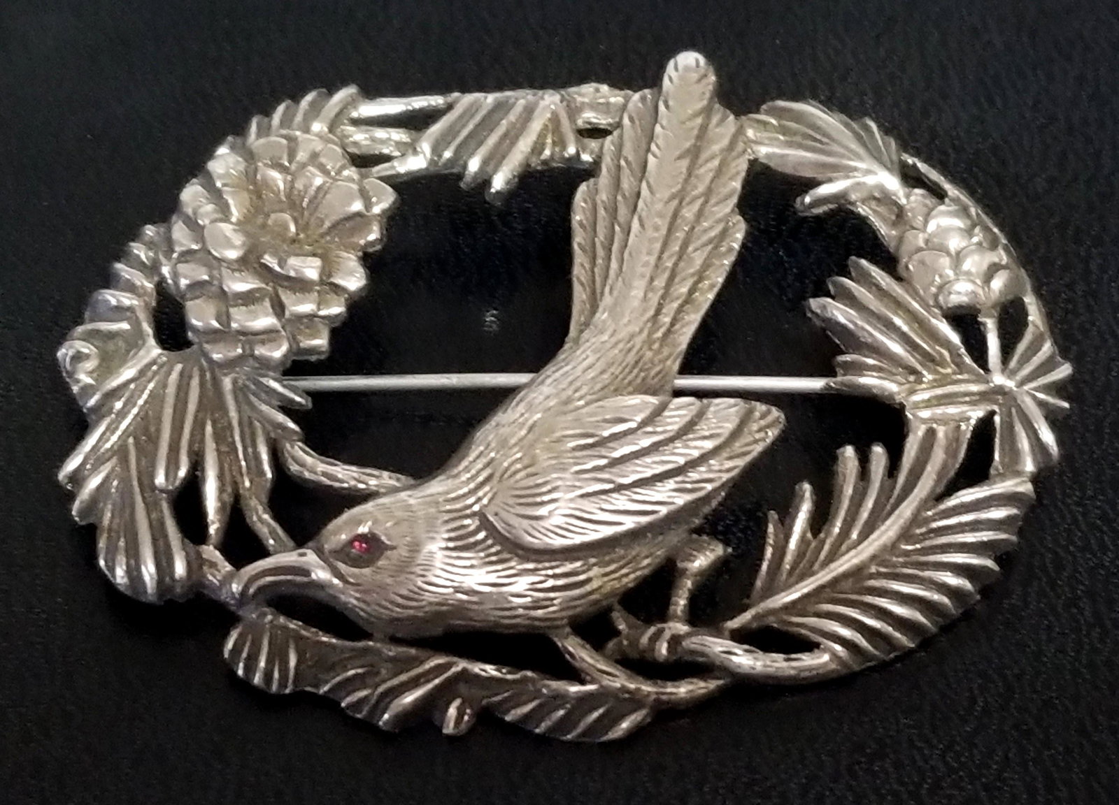 Nice Sterling Bird and Flowers Sterling Pin Brooch: Sterling silver pin brooch, bird's eye is a red ruby