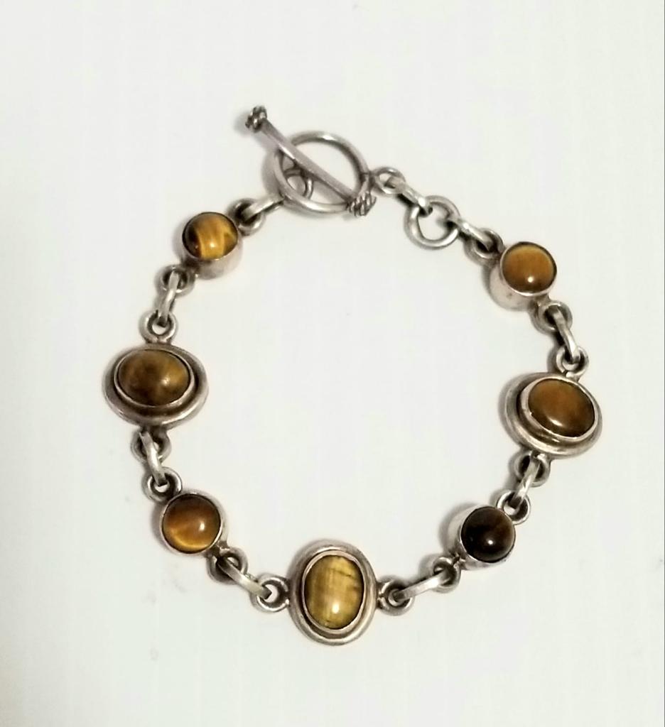 Vintage 925 Sterling Natural Tiger Eyes Bracelet: 925 sterling silver, natural tiger eyes, 19 cm or 7.5 inches long, 14.9 grams.