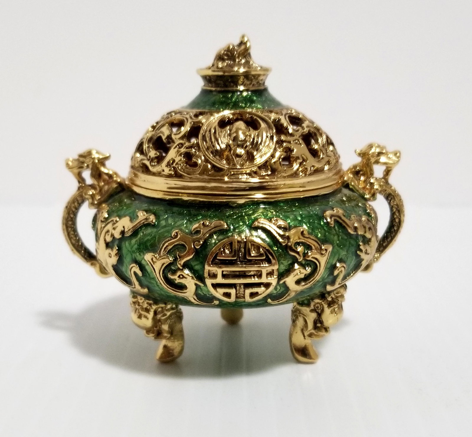 Metal Censer Jade Elephant Inside Incense: Nice Metal censer jade elephant inside incense, gold tone and green enamel, Buddhist elephant, 2 1/2 x 3 inches round.