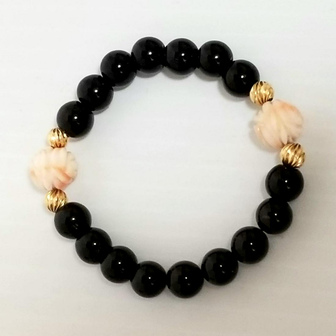 Nice 14 KT Black Onyx Angel Coral Bracelet: Beautiful 14 KT gold, hand carved beads bracelet, 8 mm black onyx, 5 mm 14 kt beads, 10 mm angel coral hand carved pink beads.