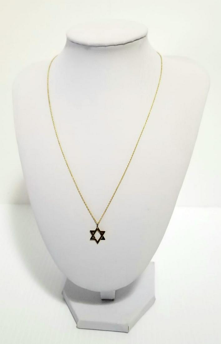 Nice 14 KT Star Of David Pendant and Necklace Set: Beautiful 14 kt yellow gold star of David pendant and chain necklace, 1.6 grams, 1.0 dwt, 1.4 cm to 1 cm 18 inches long.