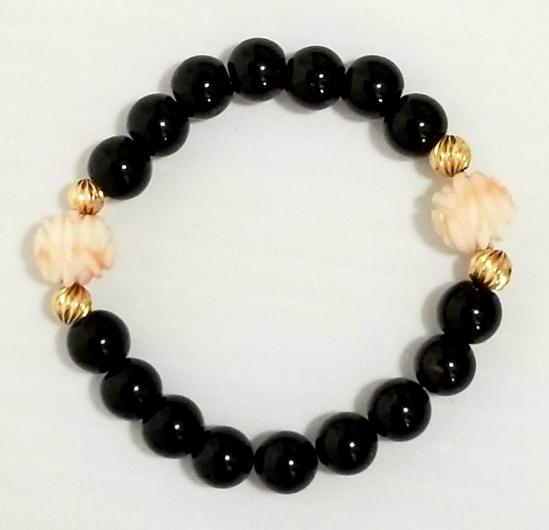 Nice 14 KT Black Onyx Angel Coral Bracelet: Beautiful 14 KT gold, hand carved beads bracelet, 8 mm black onyx, 5 mm 14 kt beads, 10 mm angel coral hand carved pink beads.