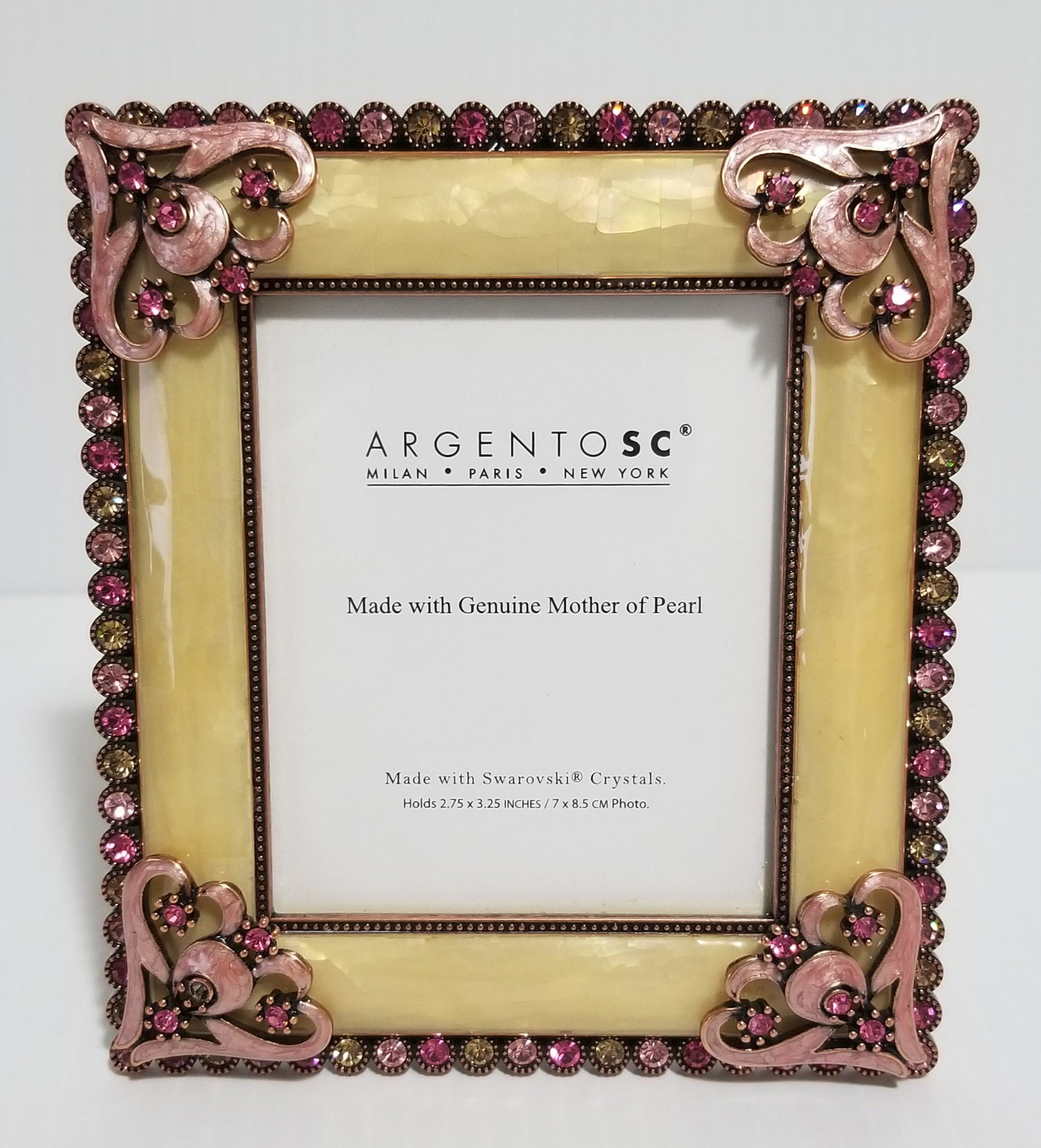 Argento SC Swarovski Mother Pearl Frame: Argento SC, Swarovski crystal, brass, mother pearl, it has a tag, picture: 2.75 x 3.25 inches, frame: 4 3/4" x 4 1/4". Value: $180.