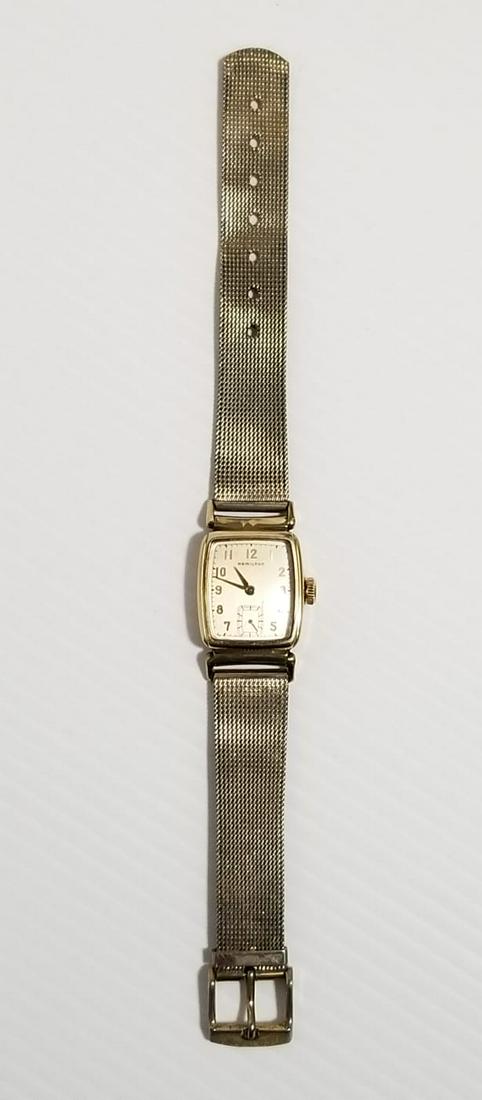 Vintage Hamilton 10 KT Gold Filled Mechanical Watch: Beautiful Hamilton 10 KT gold filled mechanical watch, 29 mm x 25 mm, the gold filled wore off due to time and use, handle looks silver because it lost the golden color, works perfectly.