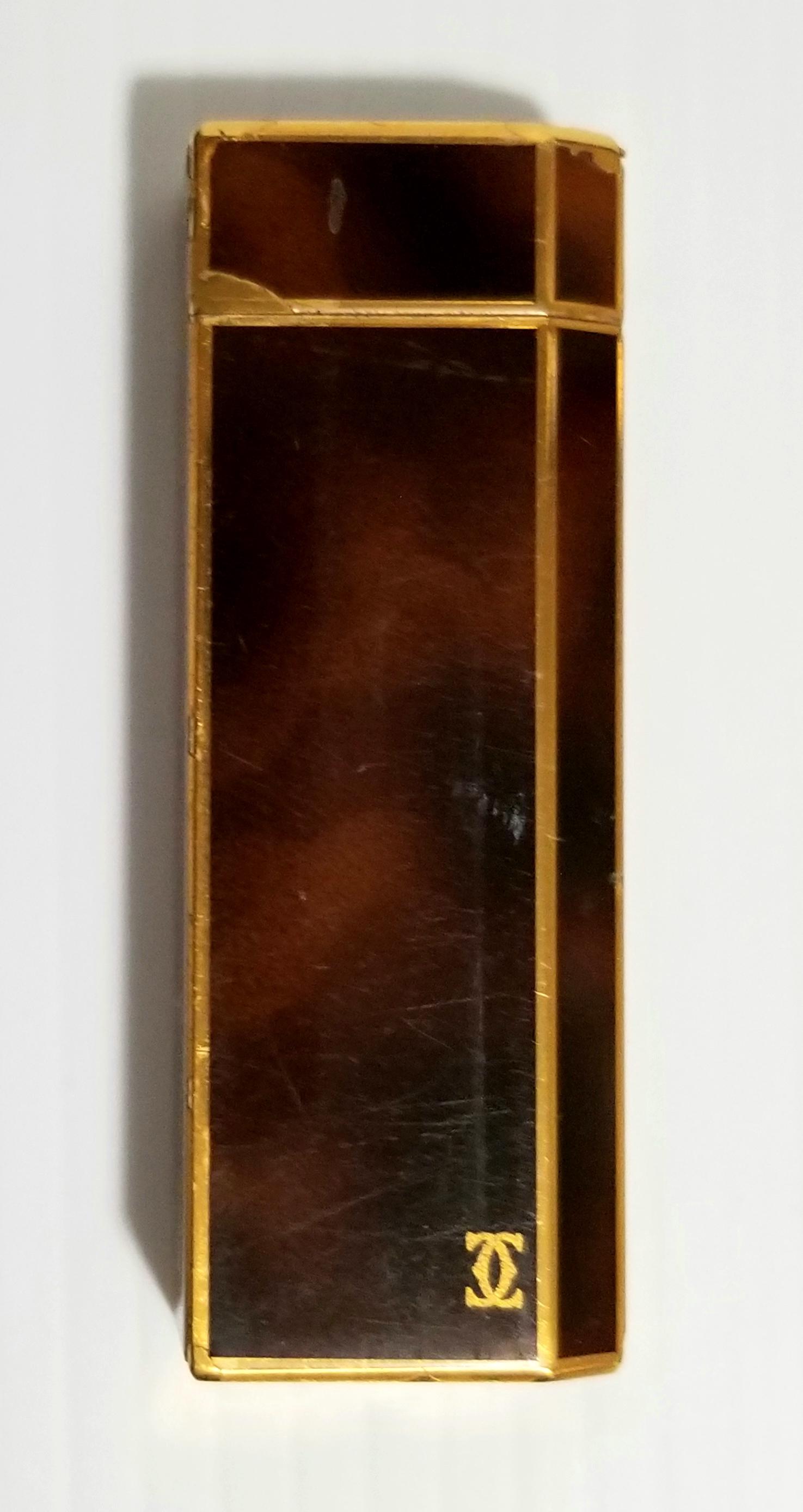 Amazing Cartier Gold Tone Lighter: Nice Cartier, made in Paris, France, gold tone lighter, 2 3/4 x 1 x 1/2 inches. It is missing some parts, please refer to pgotos for more details. It needs a new stone and gas.