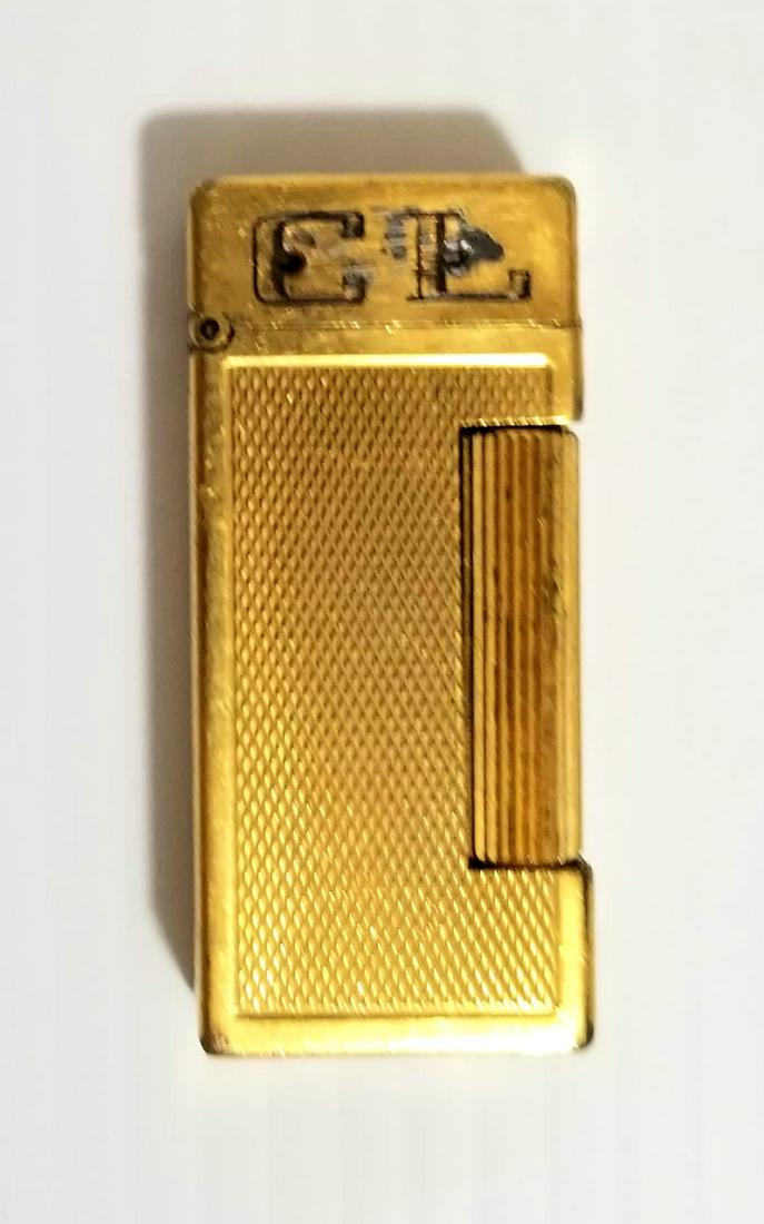 Amazing Dunhill London Lighter: Nice Dunhill lighter, made in Switzerland, C.L. letter on the front, 2 x 7/8 x 1/2 inches.