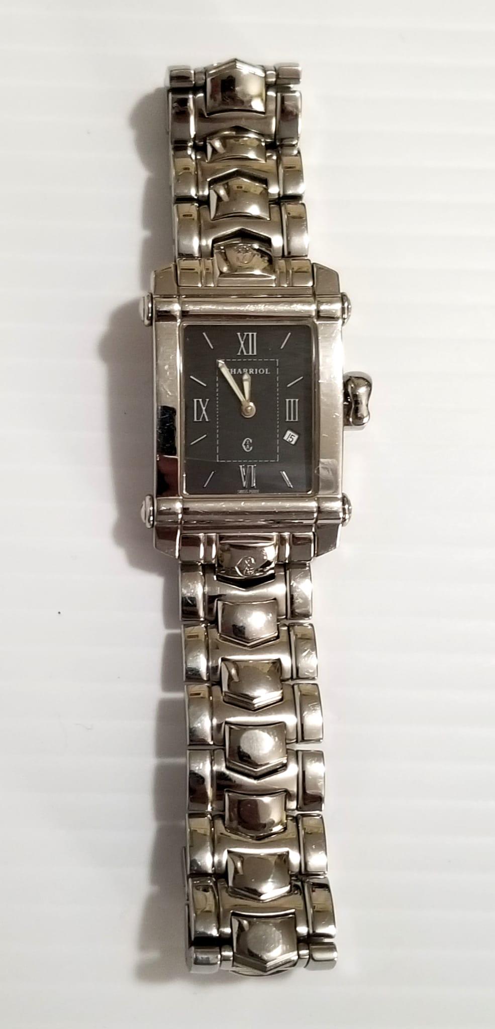 Philippe Charriol Columbus Swiss Quartz Watch: Beautiful Philippe Charriol Columbus Swiss quartz watch, black sphere, case 30 mm x 25 mm, marked Philippe Charriol, Swiss made, reference CCSTRH8, band 7 inches approx. Works perfectly.