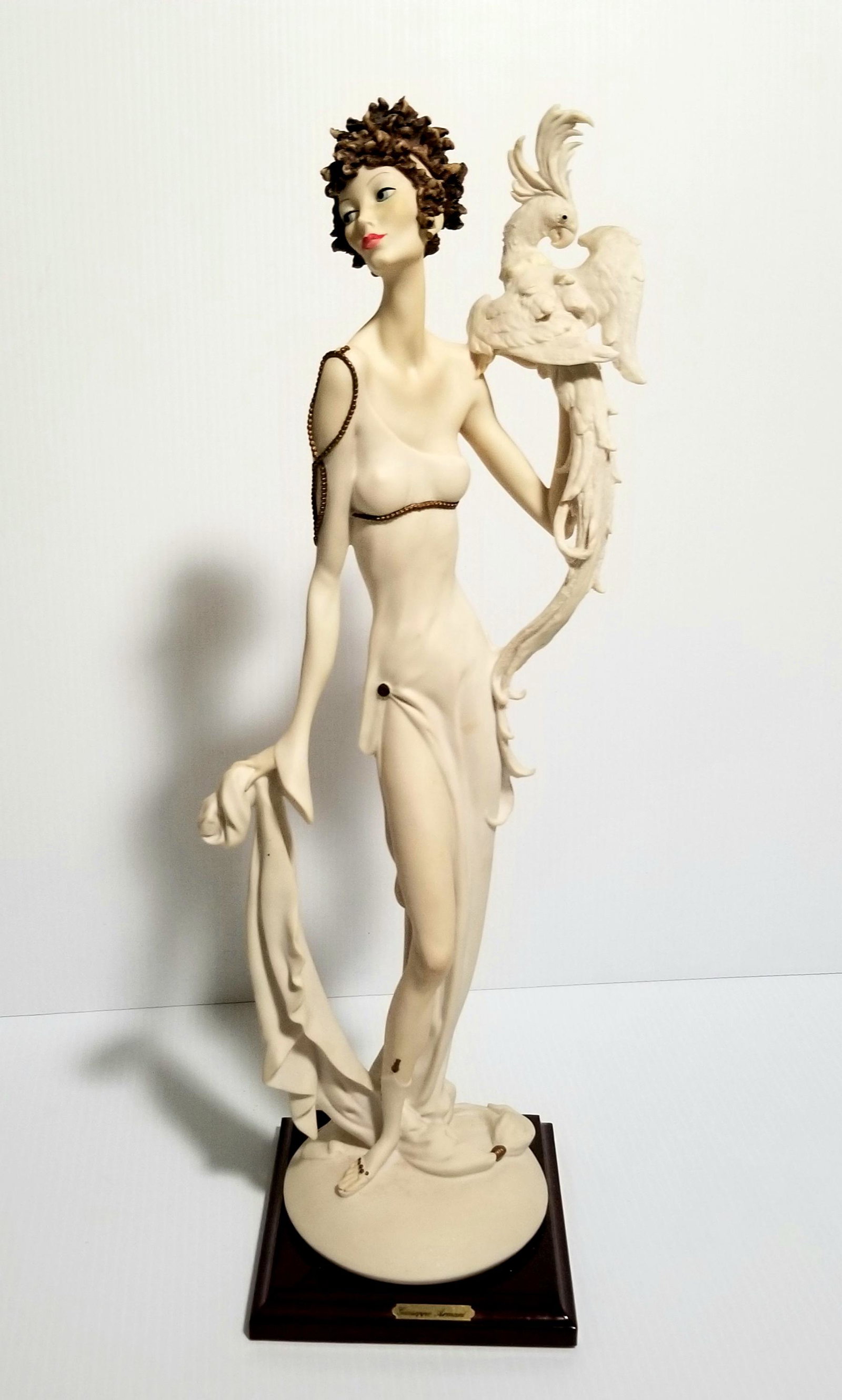 Amazing Giuseppe Armani Figurine: Beautiful Giuseppe Armani lady with cockatoo figurine, 18 1/2 x 5 x 5 inches.