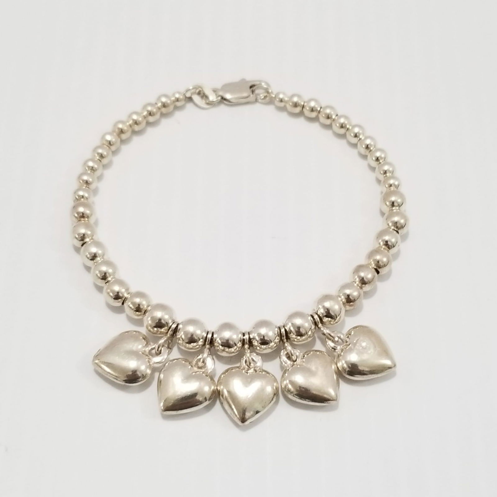 Amazing 925 Sterling Italy Hearts & Beads Bracelet: Beautiful 925 sterling silver Italy hearts and beads bracelet, 7 1/2 x 1/8 to 1/2 inches, 15.6 grams.