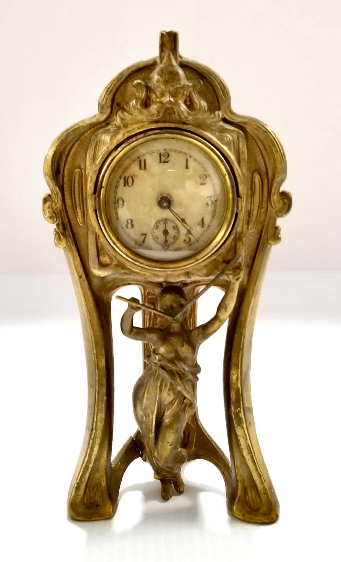 Amazing Antique Lady Table Clock: Beautiful antique lady table clock, original patina, metal, works perfectly, 8 1/4 x 4 x 2 1/4 inches. It has a crack on the back, please refer to photos for more details.