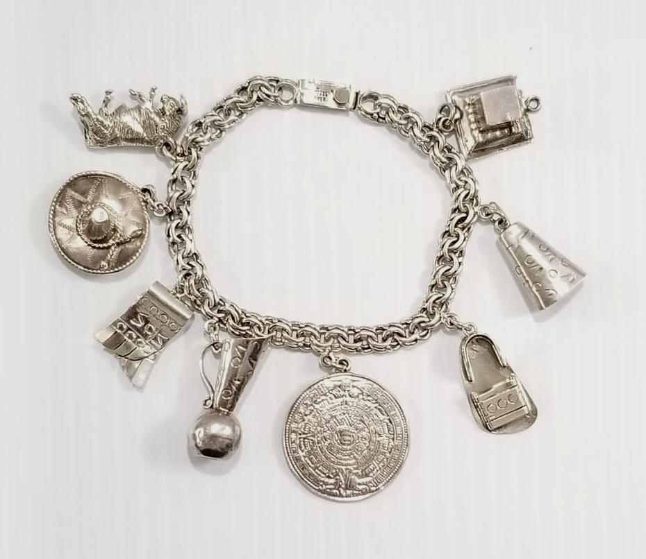 Amazing 925 Sterling Silver Charms Bracelet: Nice 925 sterling silver, 8 charms bracelet, 8 inches long x 7 mm, 39.3 grams.