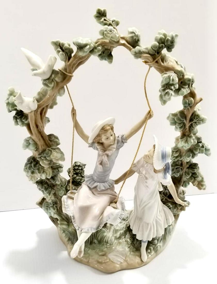 Amazing Lladro Girl In The Swing Porcelain Figurine: Large and beautiful Girl in the swing porcelain figurine, 15 1/4 x 12 1/2 x 9 inches.