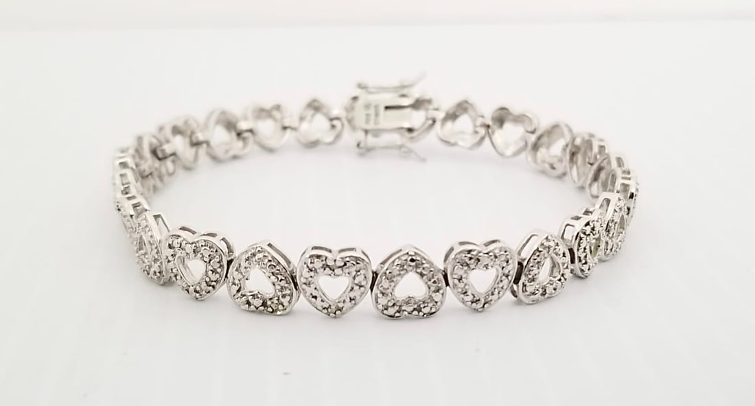 Amazing R 925 Sterling Silver Hearts Zirconia Bracelet: Beautiful R 925 sterling silver hearts Zirconia bracelet, 8 inches s 8 mm, 14.1 grams.