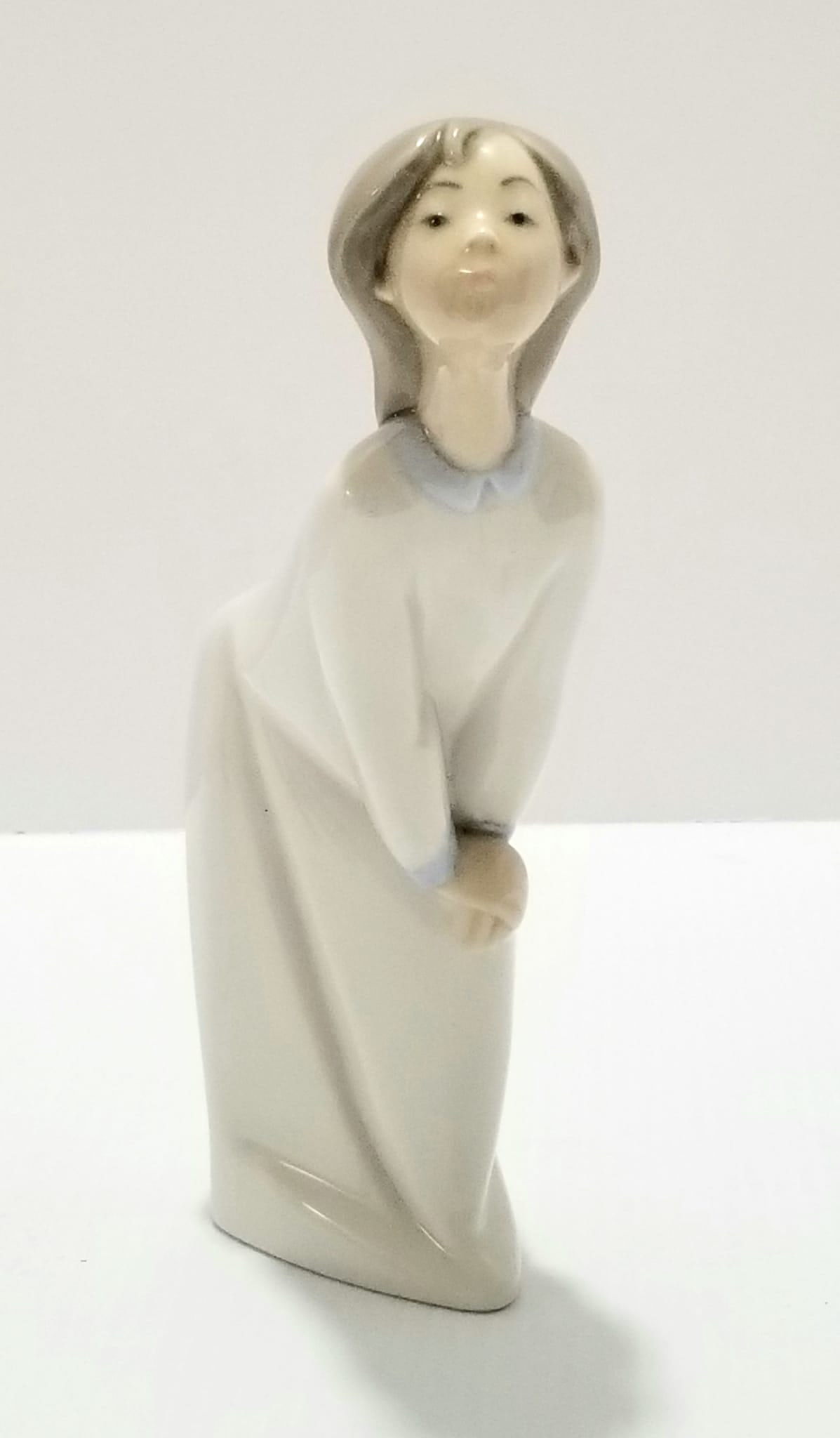 Amazing Lladro Child in Nightshirt Figurine: Nice Lladro child in nightshirt figurine, 7 1/4 x 3 x 1 5/8 inches.
