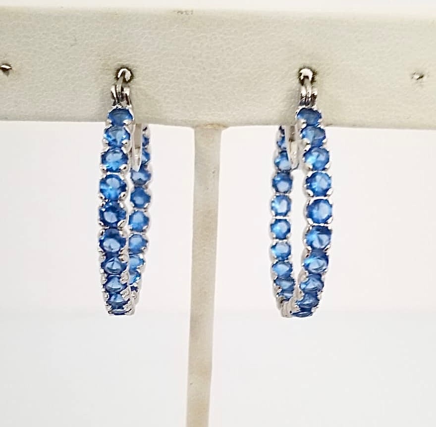 Amazing 925 Sterling Silver Blue ZC Hoop Earrings: Beautiful 925 sterling silver blue Zirconia hoop earrings, 1 1/4 inches round, 6.7 grams.
